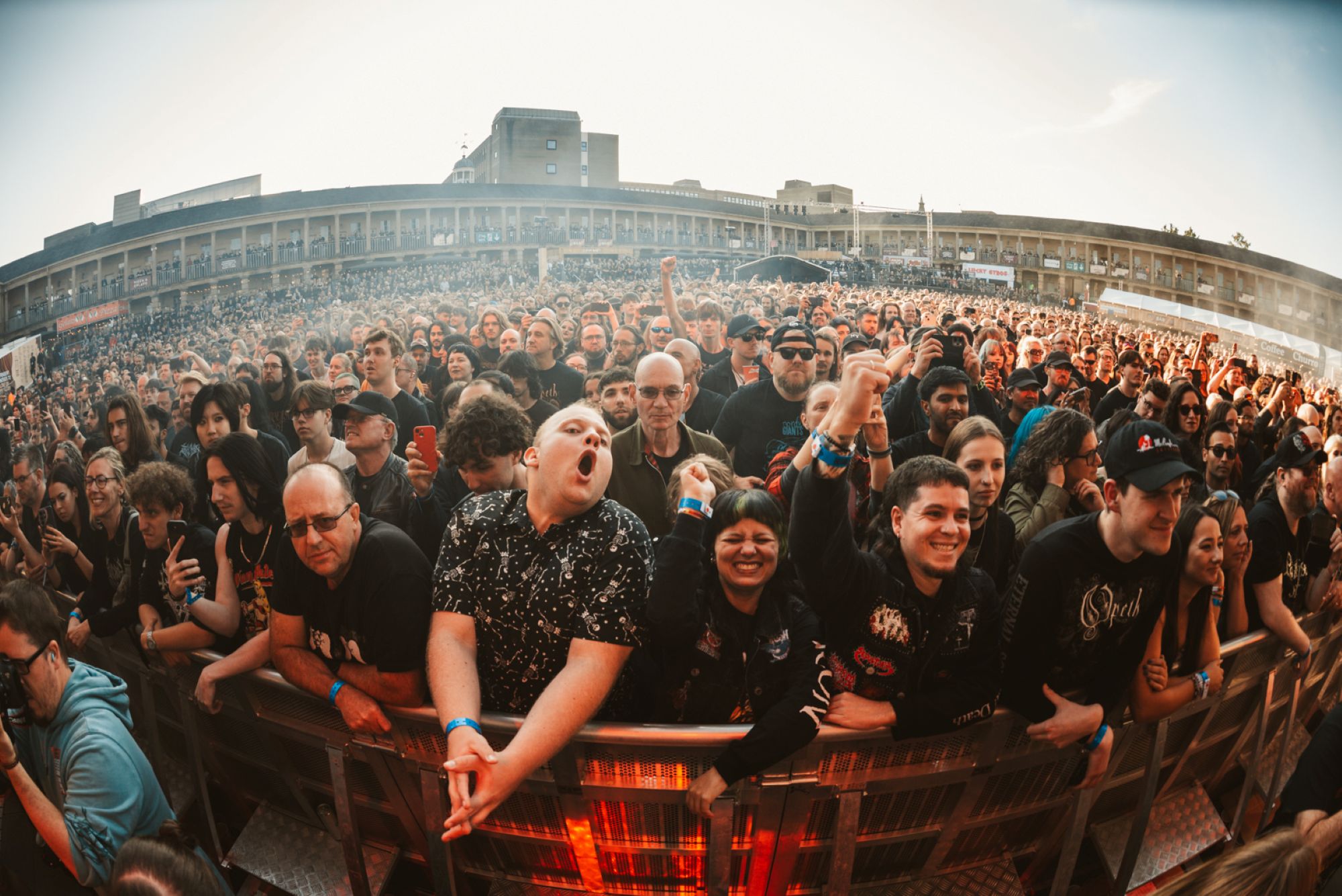 Energetic crowd at an outdoor music festival in Yorkshire