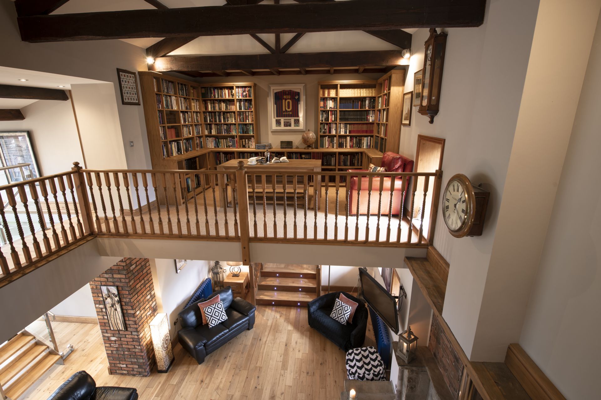 Cozy loft library with wooden beams and book-lined walls