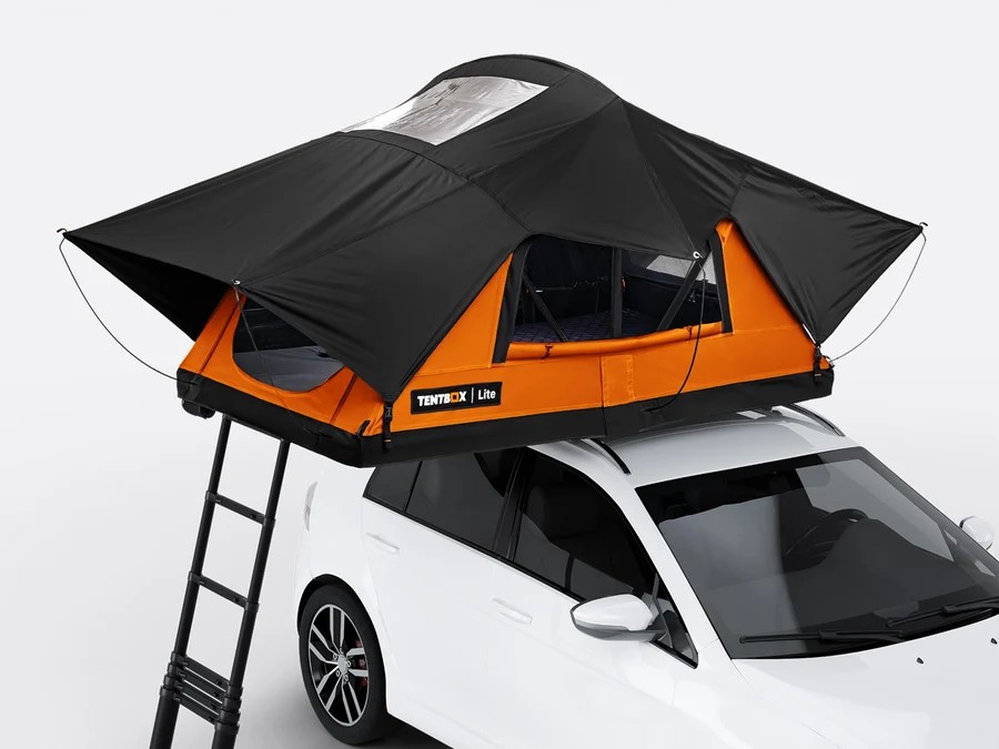 Black and orange roof tent mounted on a white car with a ladder