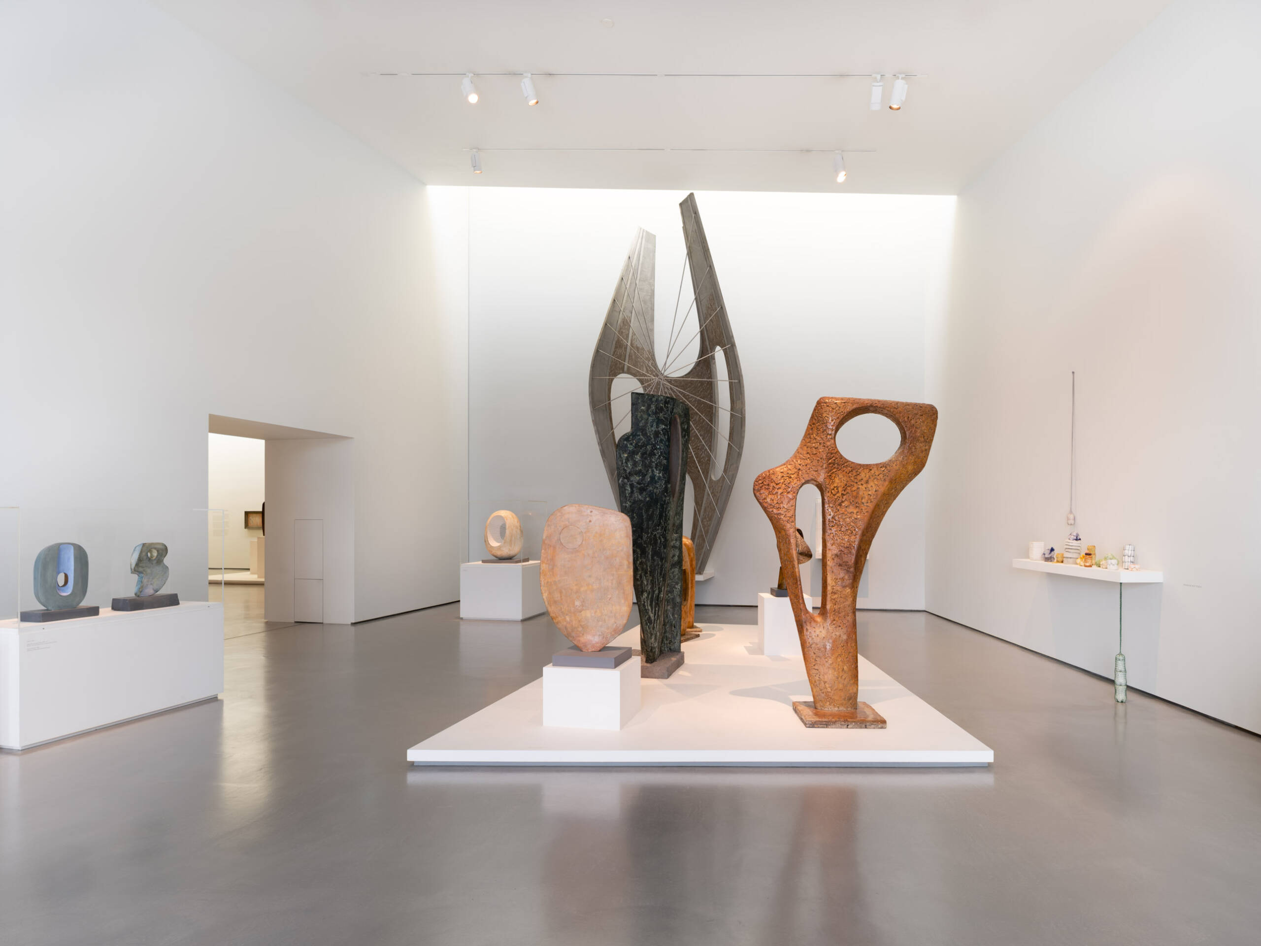 Modern abstract sculptures in a minimalist white gallery