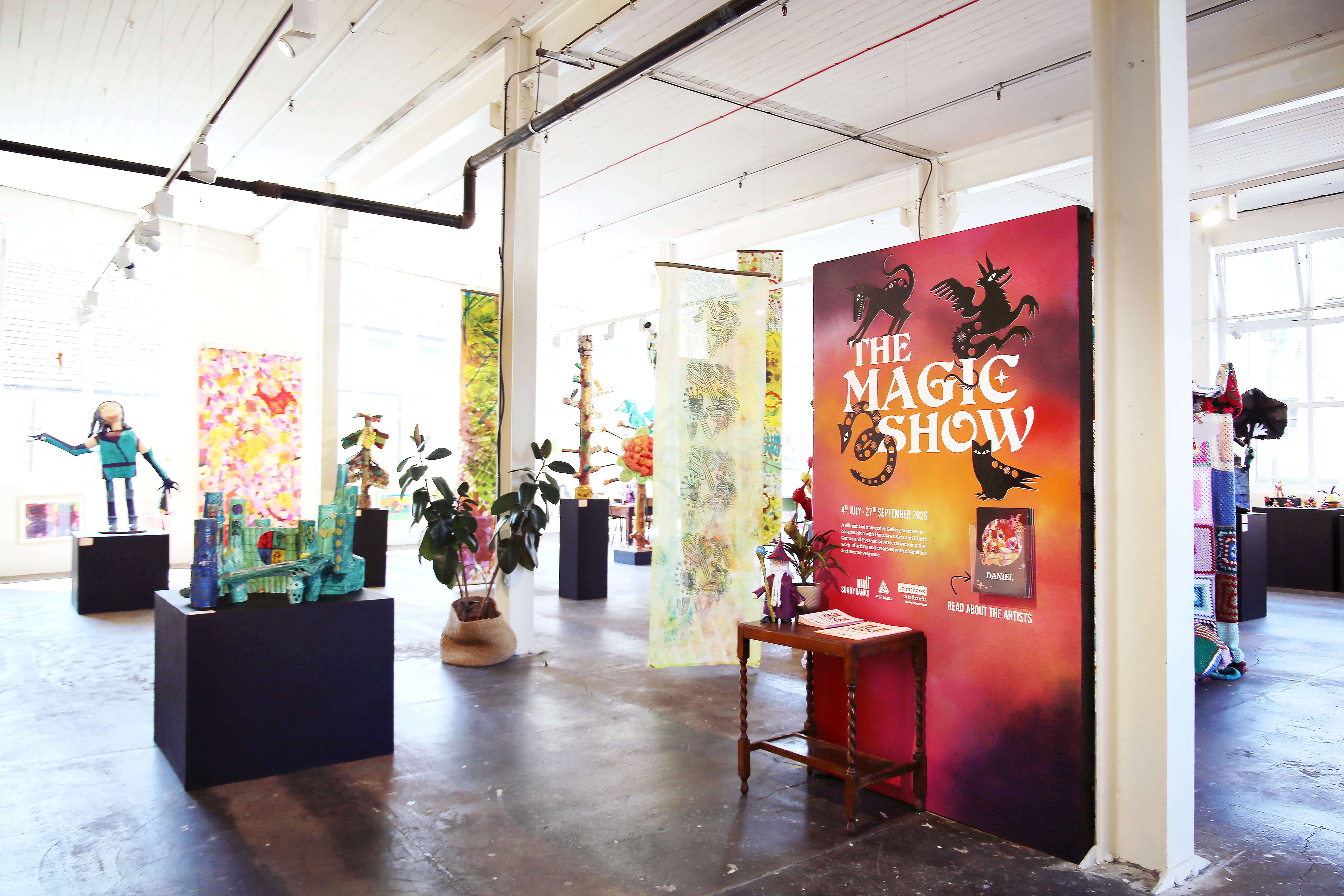 Bright art gallery with colorful posters and sculptures