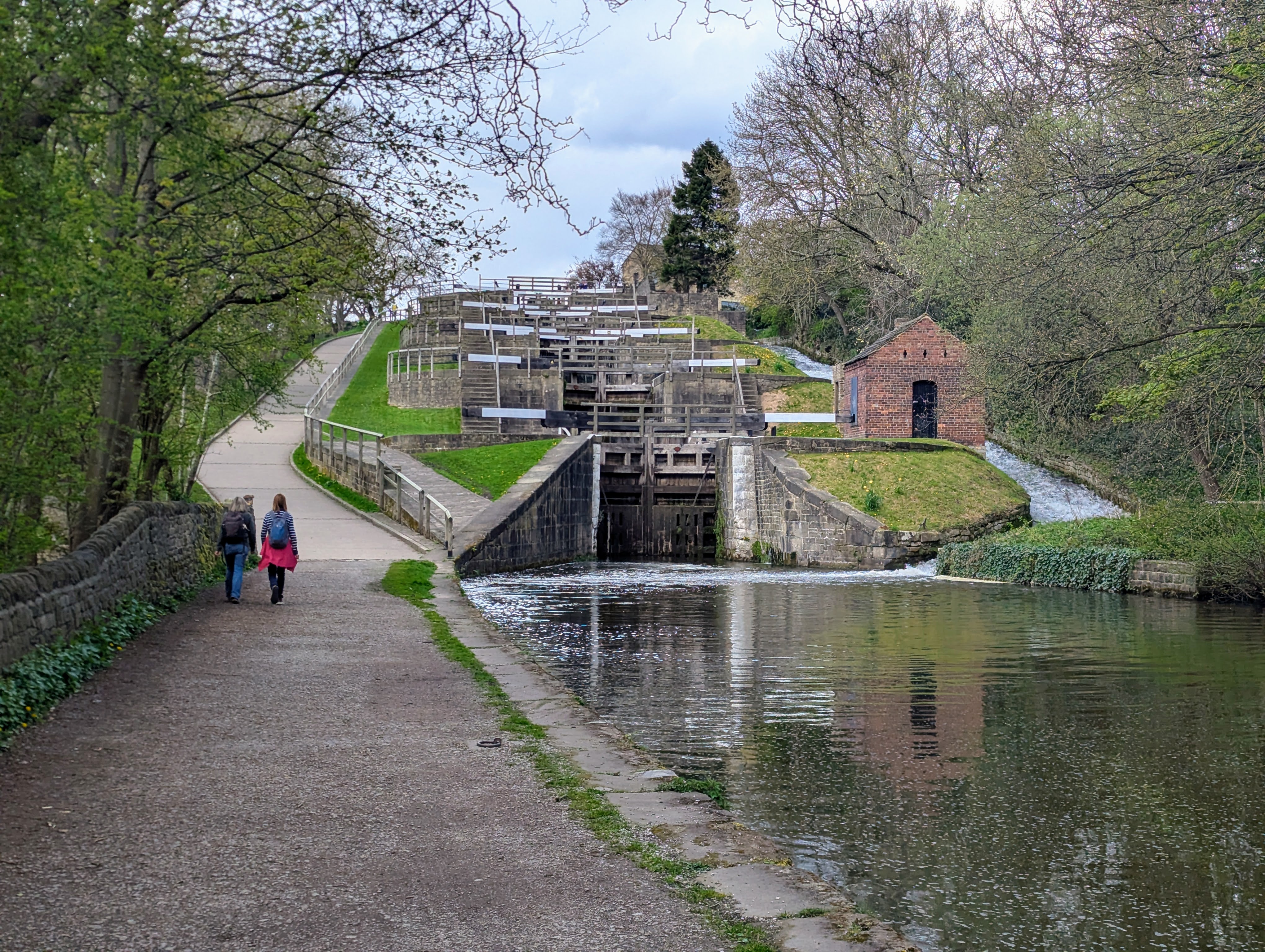 Scenic canal lock system with walking path and trees