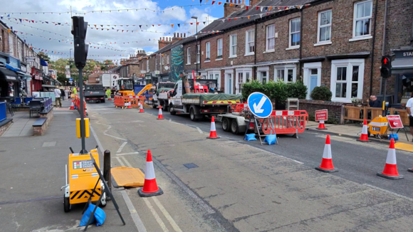 Charming street with terrace houses and roadworks in progress