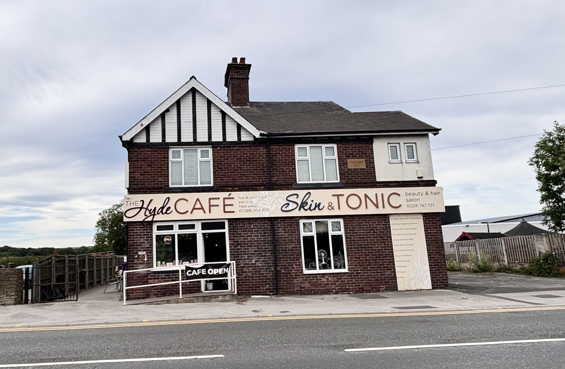 Brick building with cafe and beauty salon on a quiet street