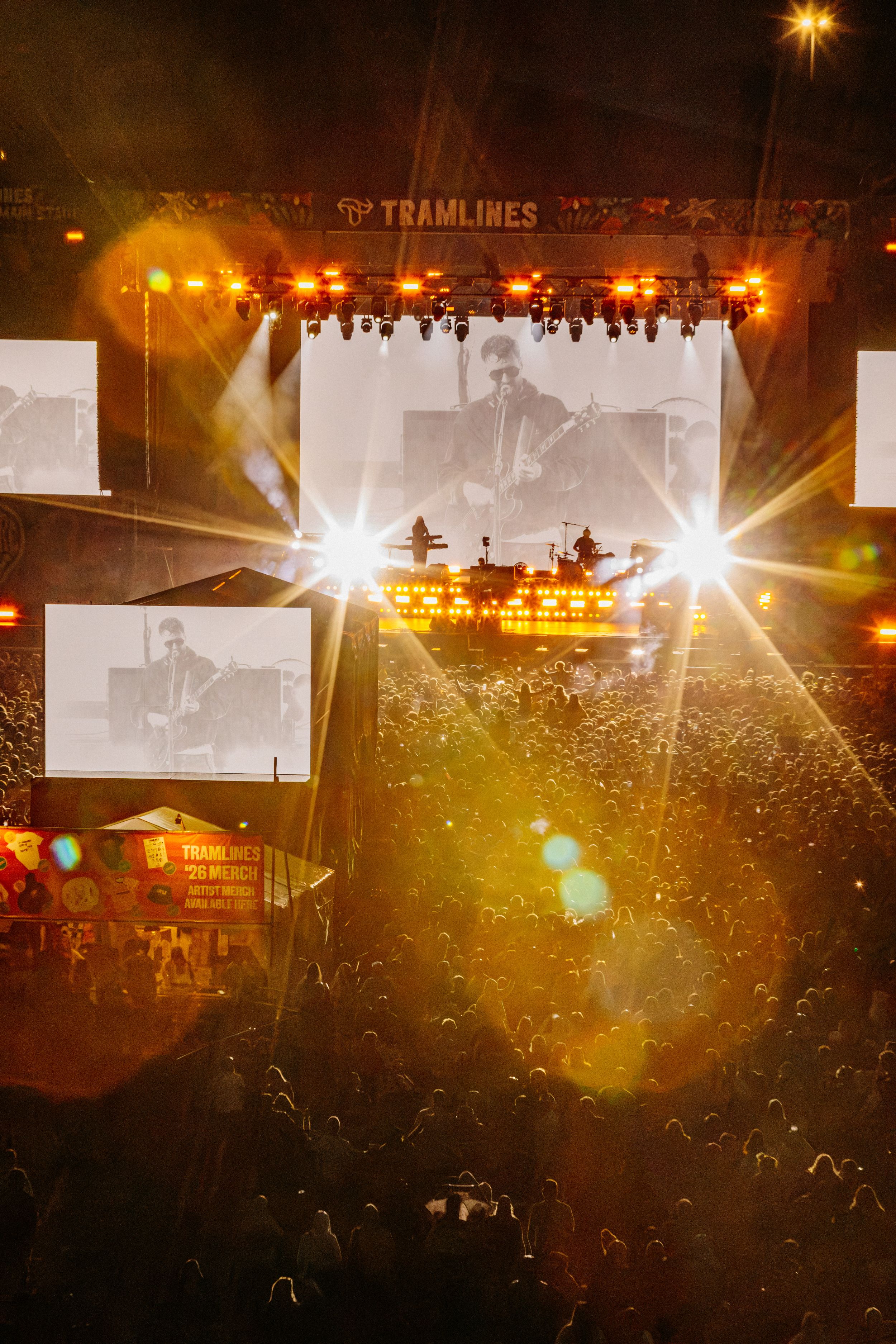 Vibrant night music festival with crowd and illuminated stage