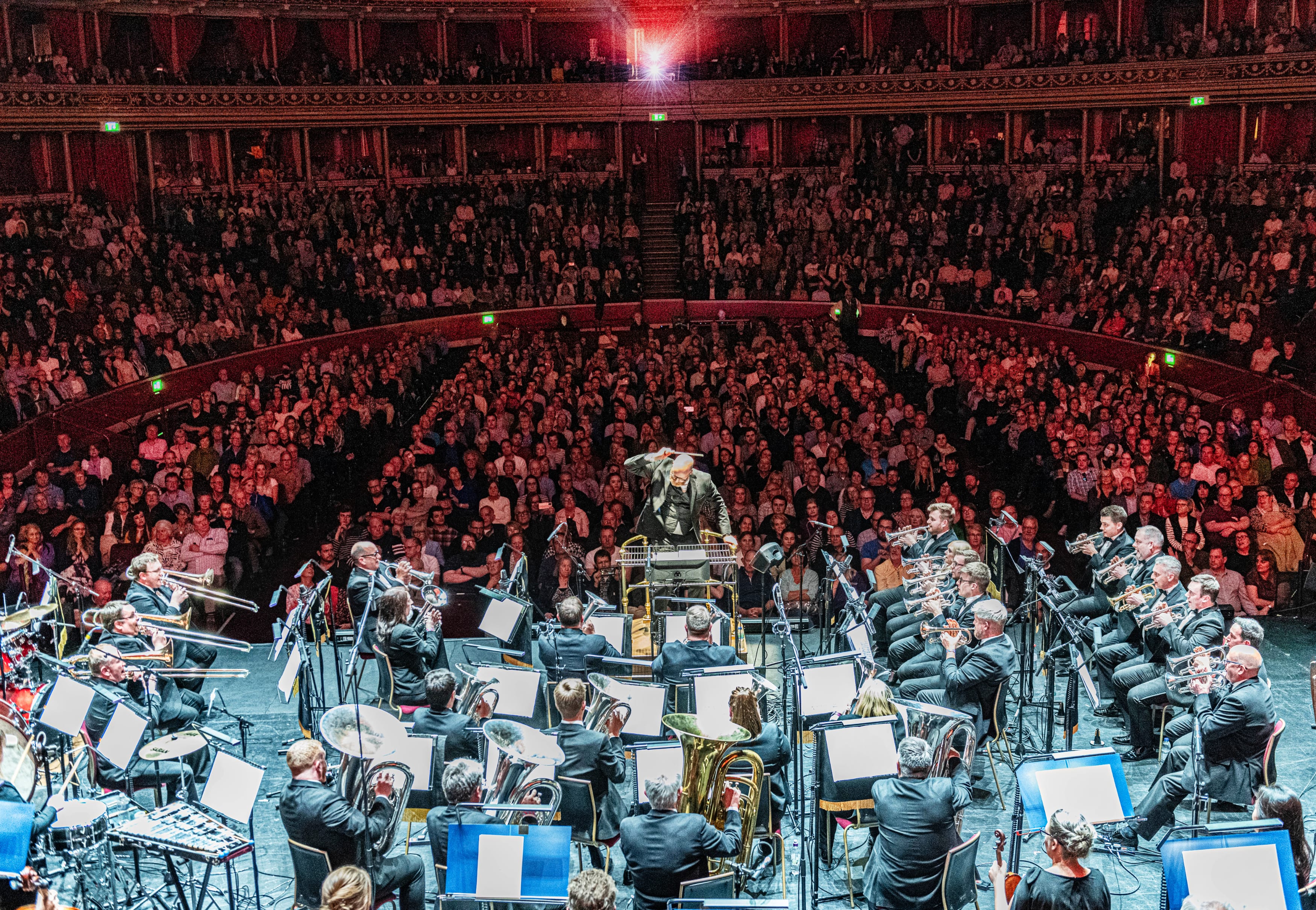 Brassed Off Live - Orchestra performing in grand circular concert hall