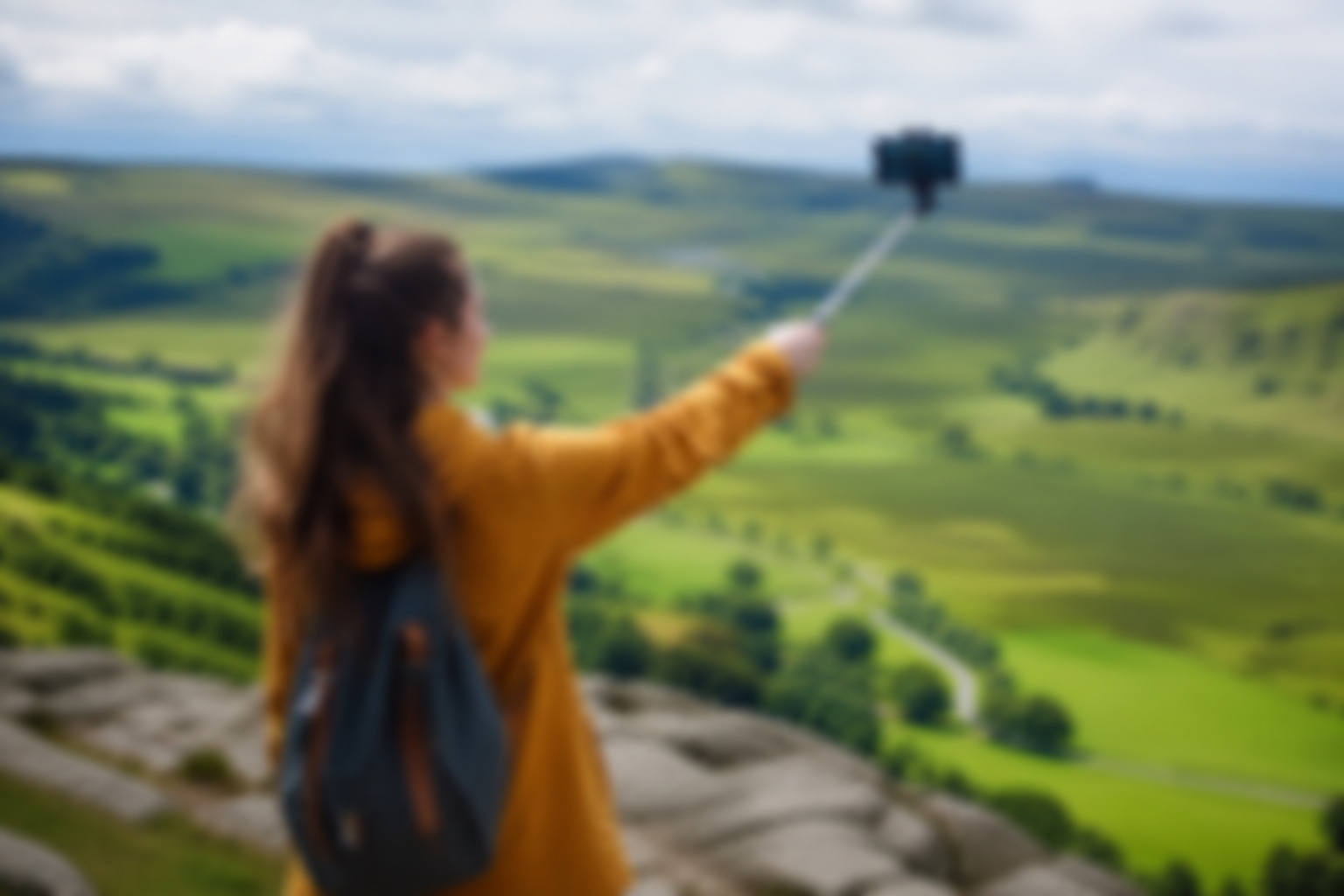 Woman taking selfie with scenic Yorkshire Dales view