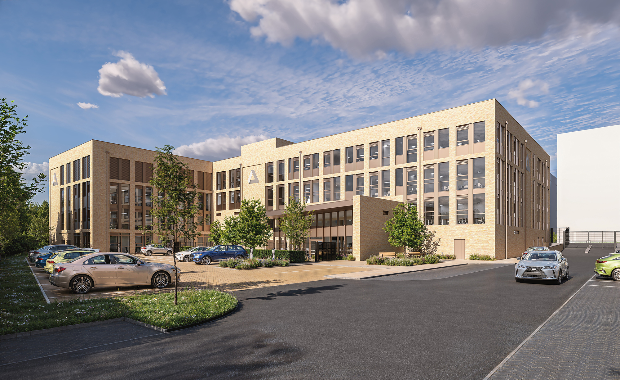 Modern brick office building with large windows and parked cars