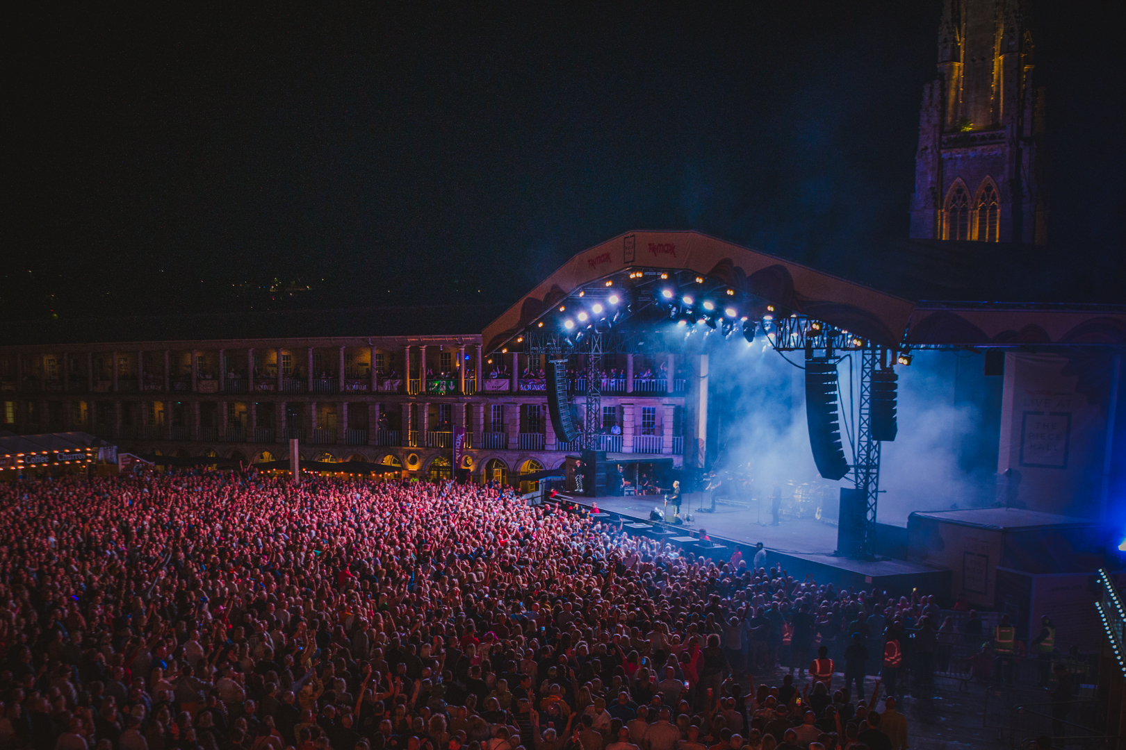 Night concert at Scarborough Open Air Theatre with vibrant lights
