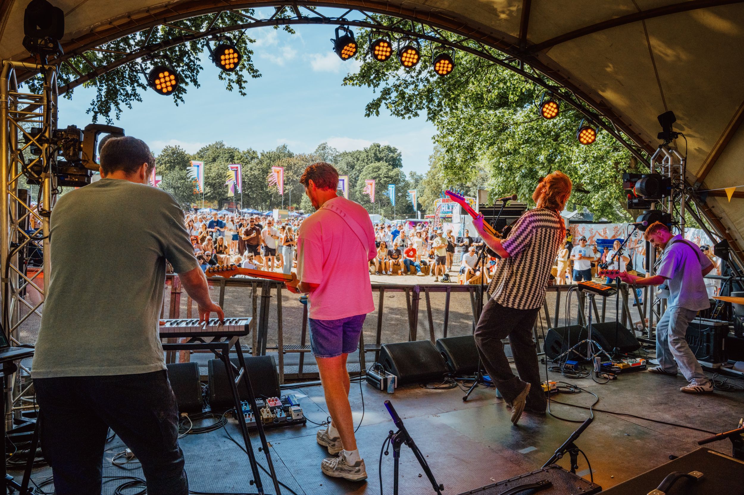 Band performing on outdoor stage at summer festival in Yorkshire
