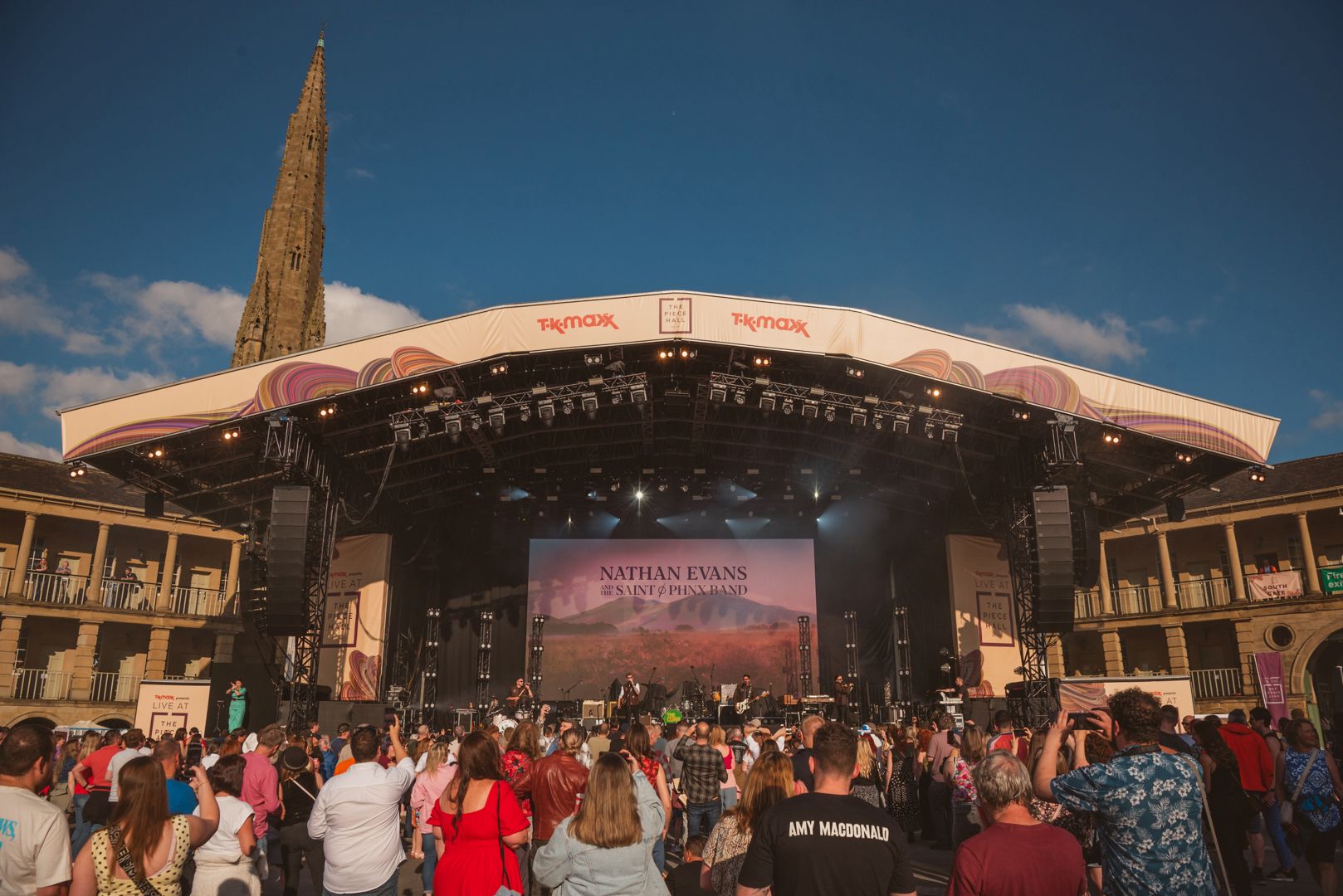 Outdoor concert at Piece Hall with crowd and historic architecture