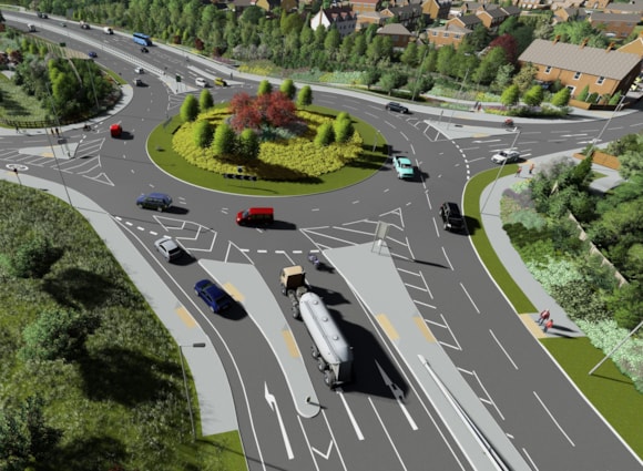 Busy roundabout with colourful cars and lush green surroundings