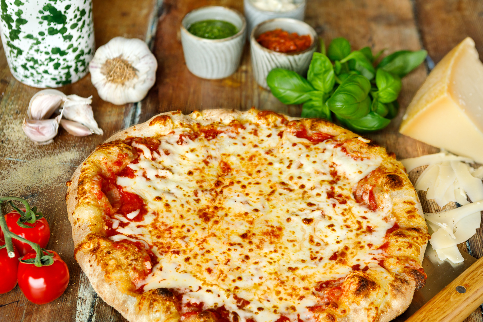 Freshly baked margherita pizza with basil and cheese