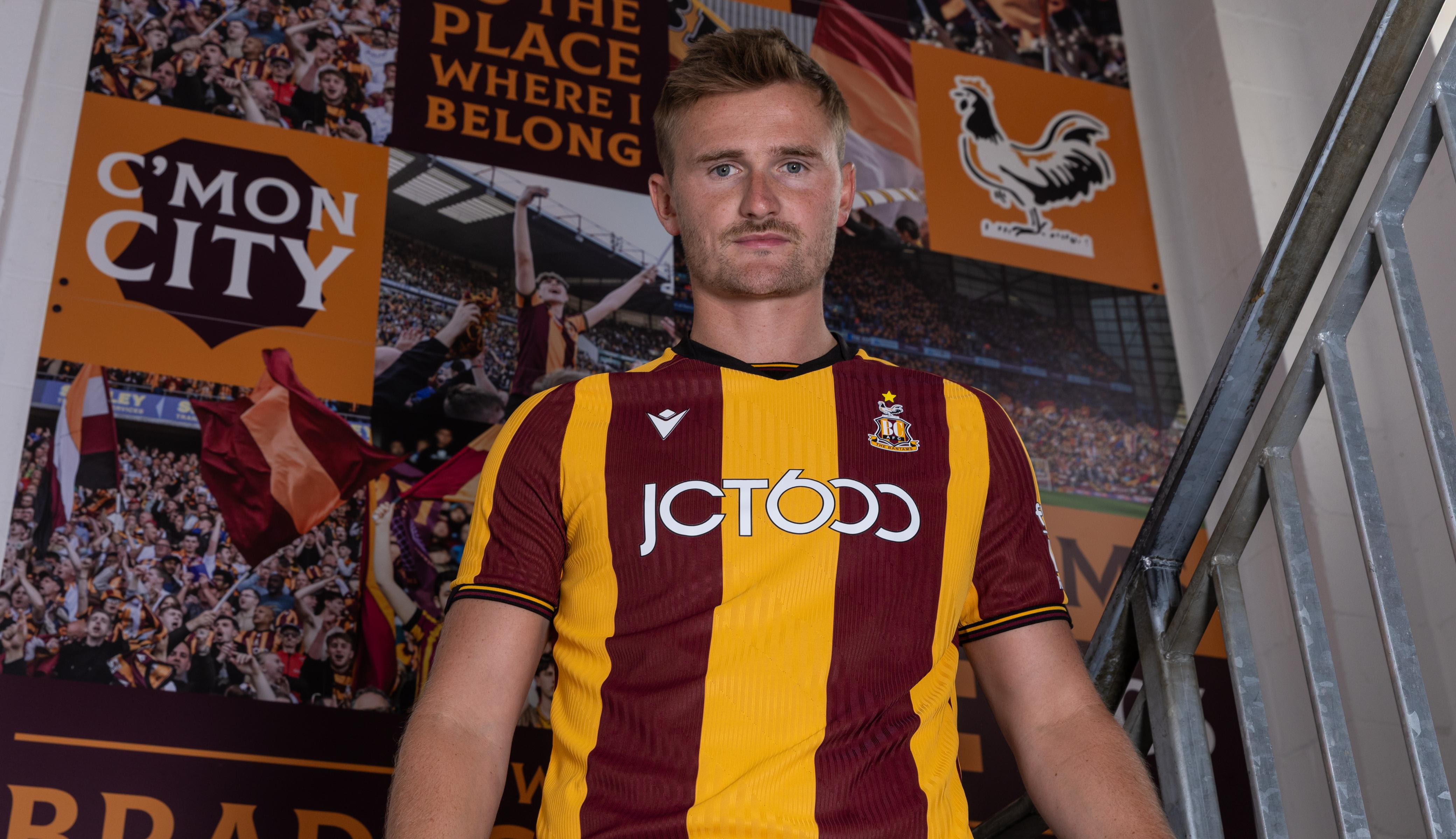 Bradford City football player on stadium stairs