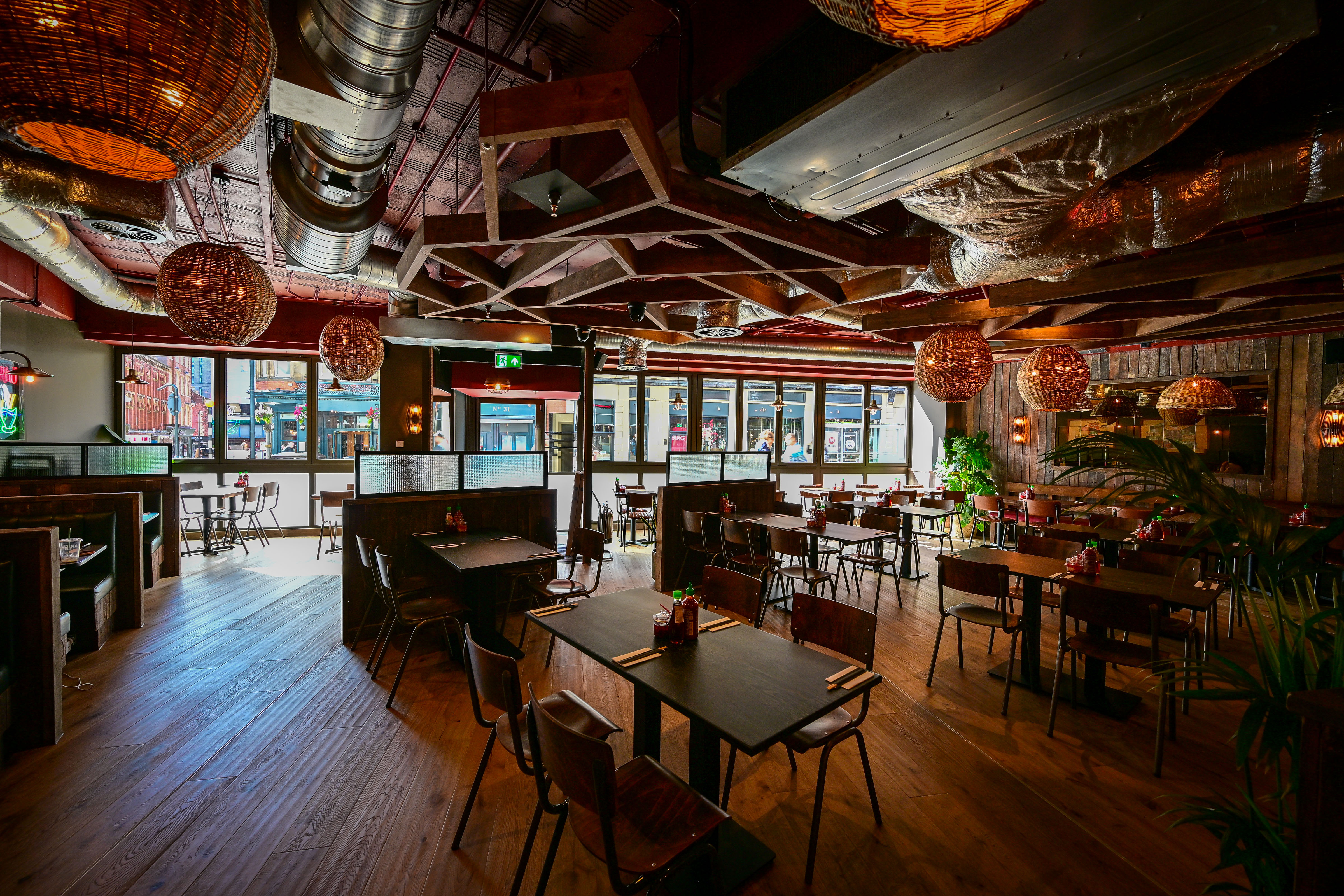 Cosy restaurant interior with wooden beams and hanging lights
