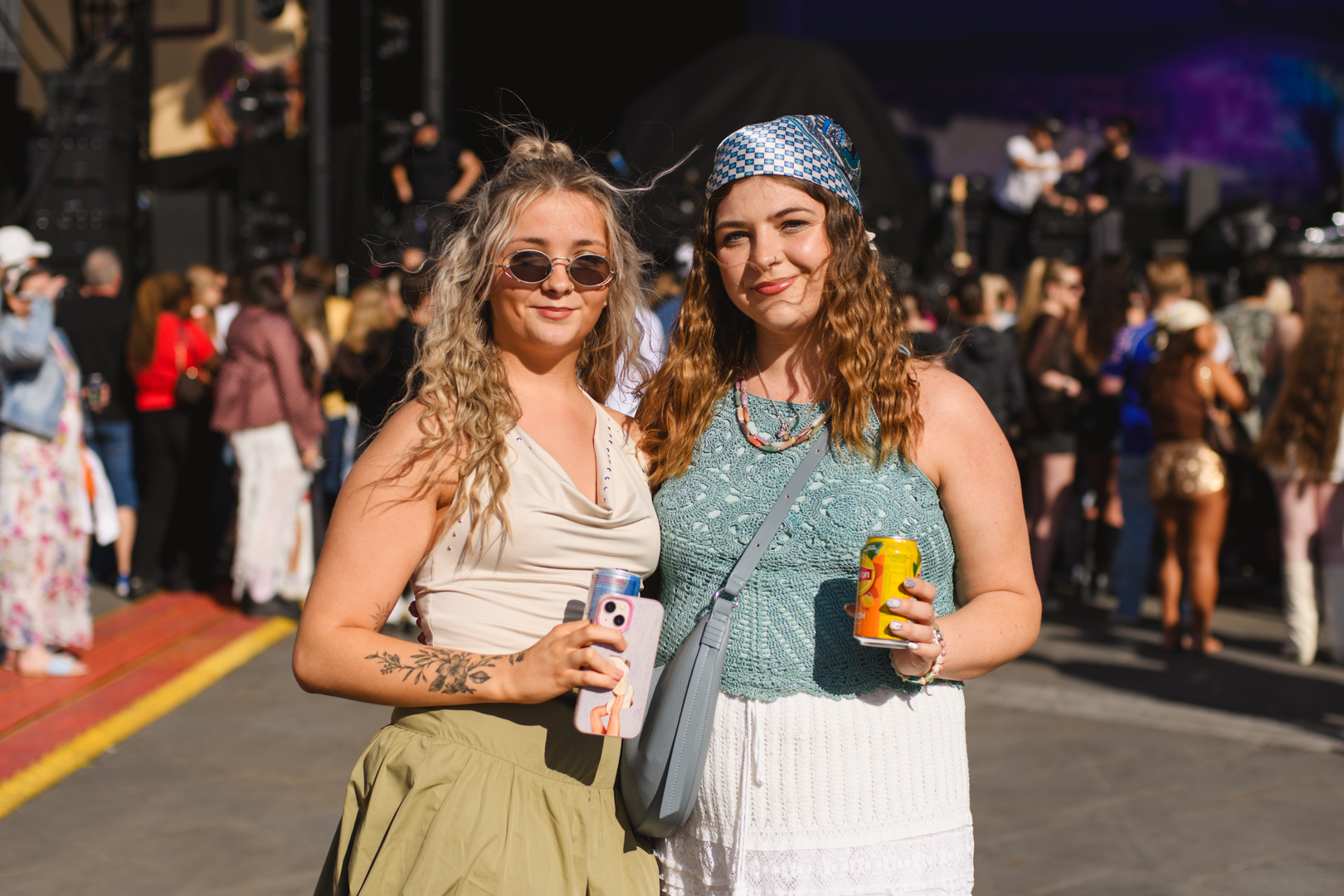 Two women enjoying a sunny festival in Yorkshire