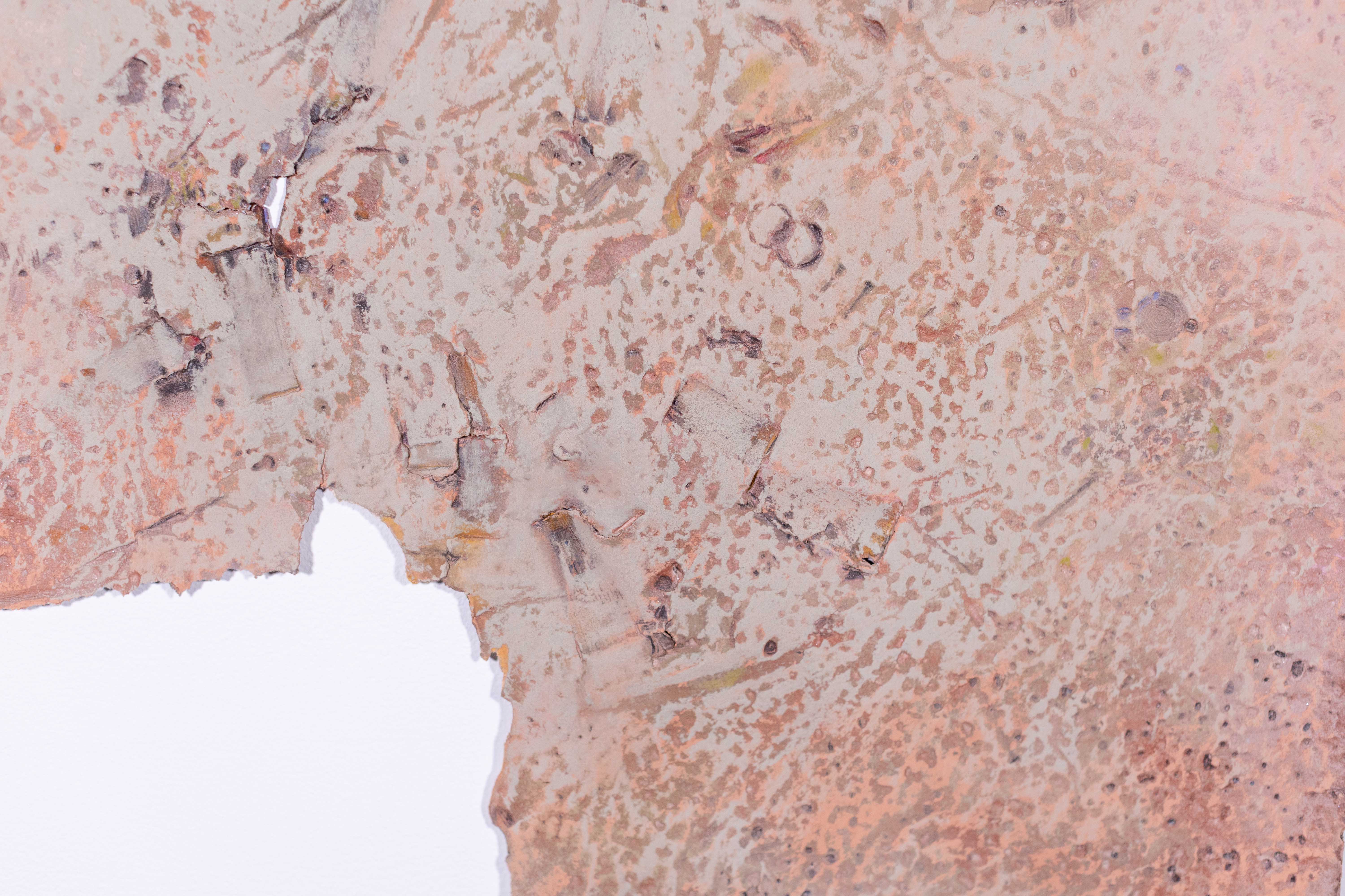 Close-up of textured abstract artwork in earth tones