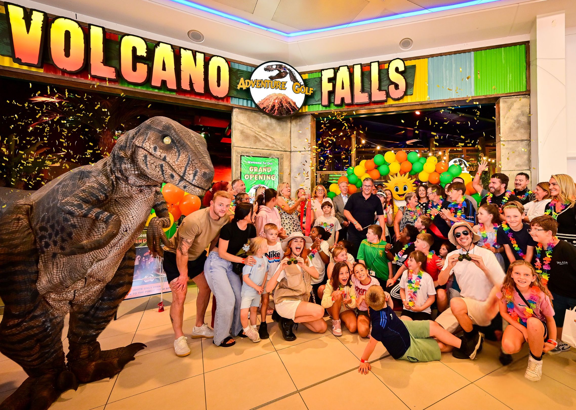 Group of people celebrating at indoor adventure golf centre