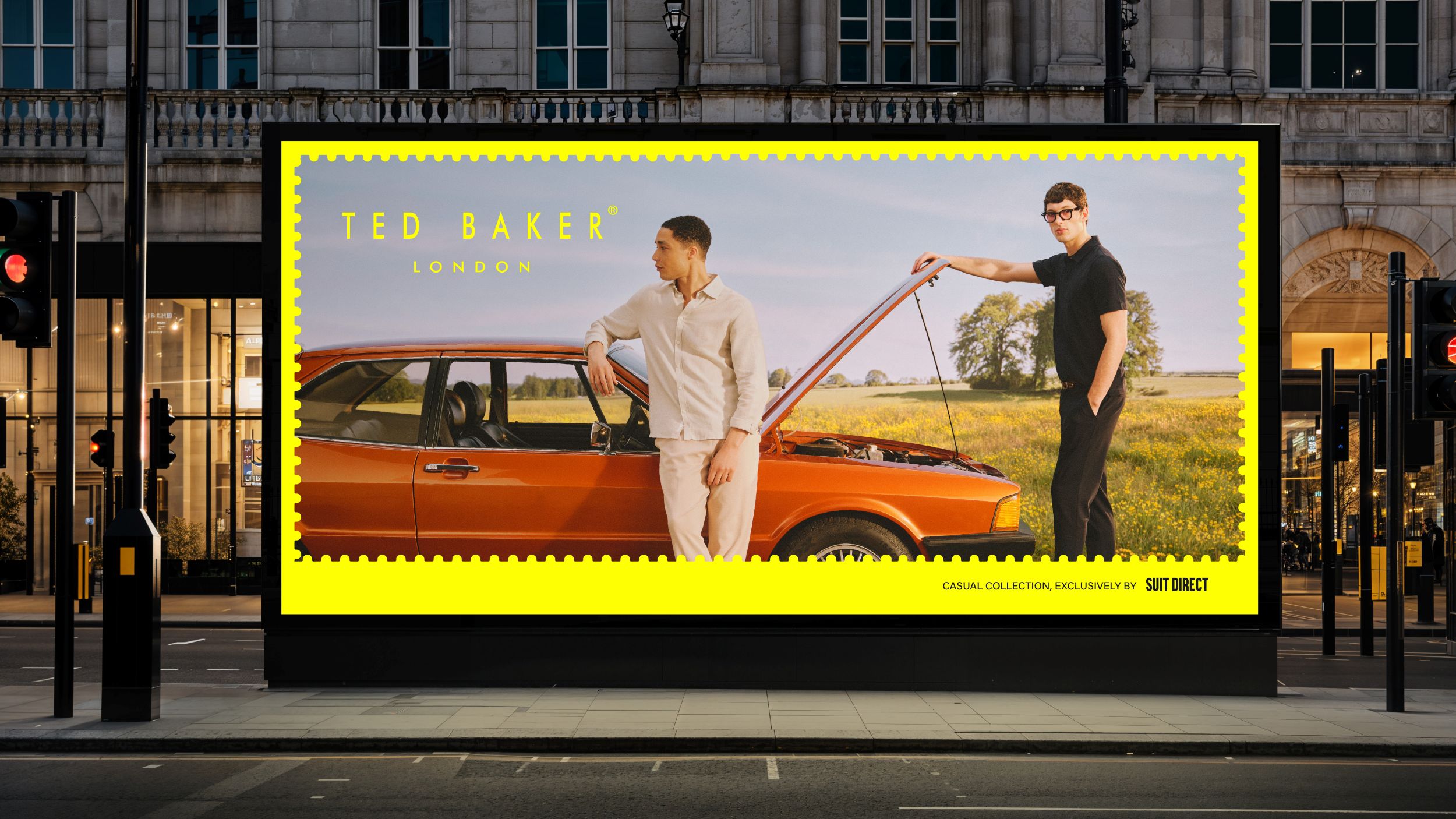 men standing by vintage car in countryside background