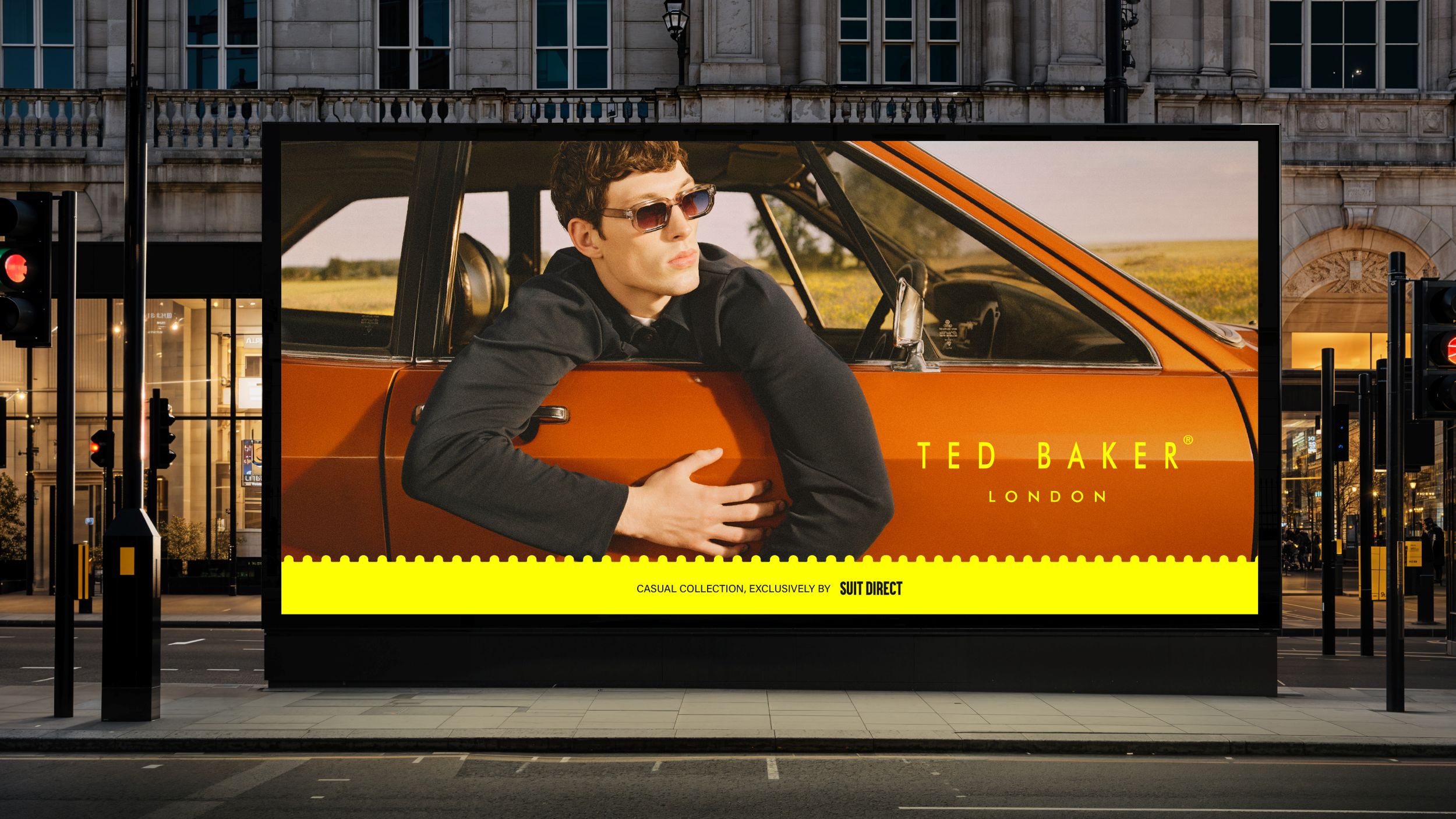 large Ted Baker advertisement on city street at dusk