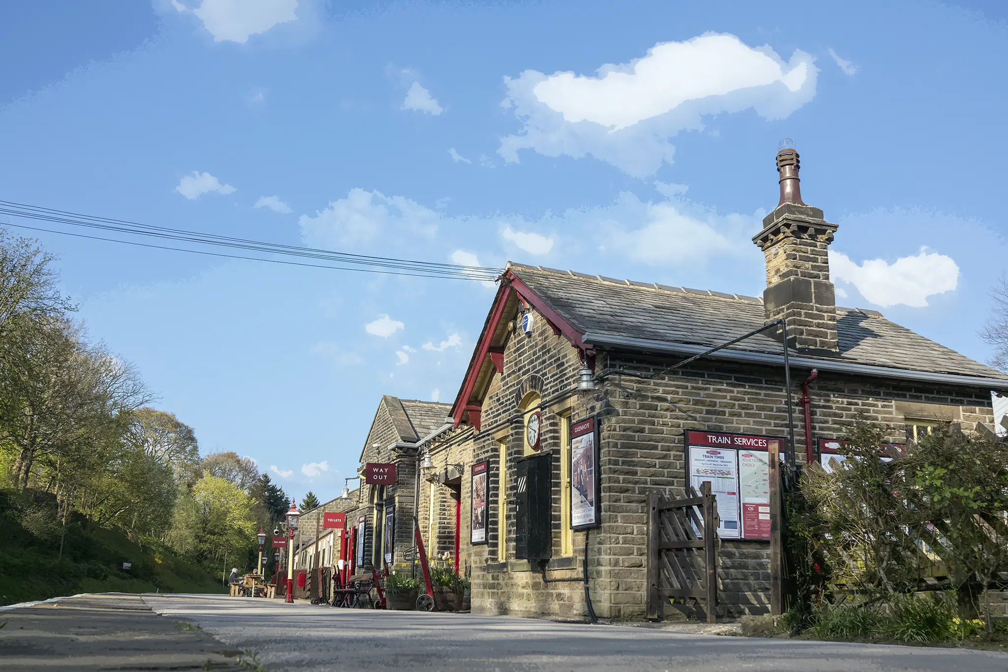 Historic stone train station with slate roof and chimney in rural Yorkshire