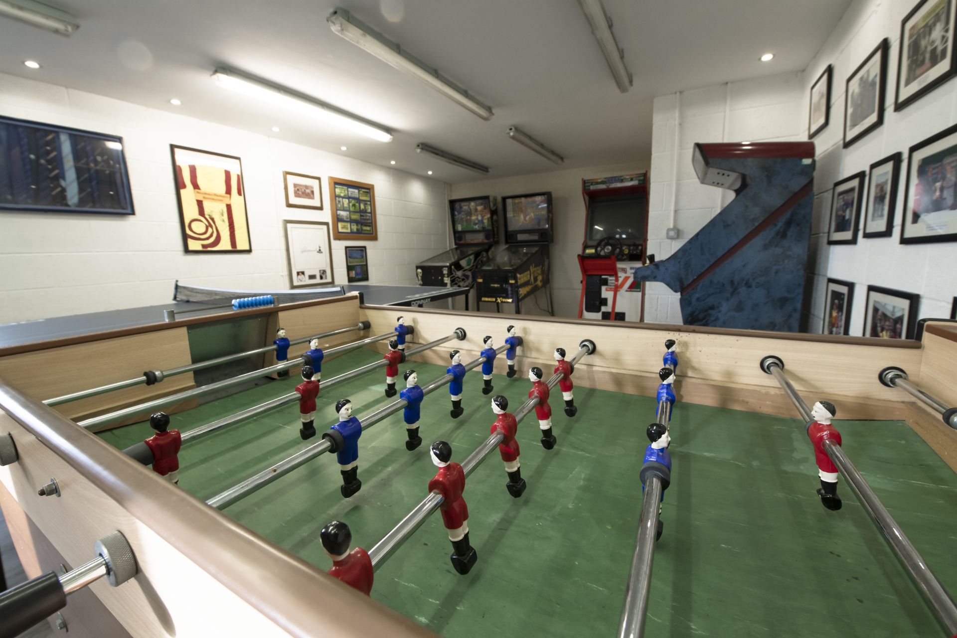 Indoor games room with foosball table and arcade machines