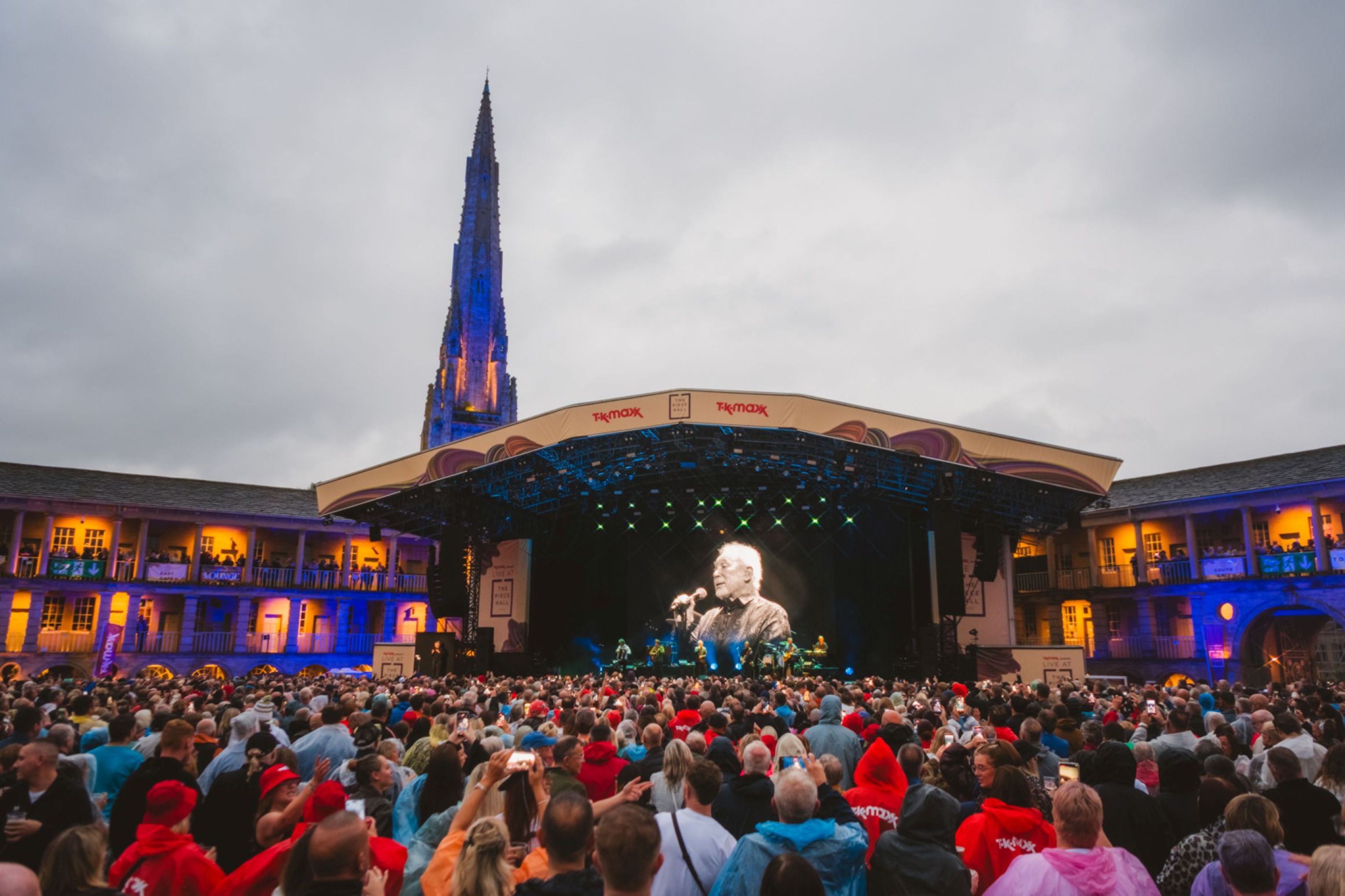 Crowd at outdoor concert in Halifax with illuminated spire