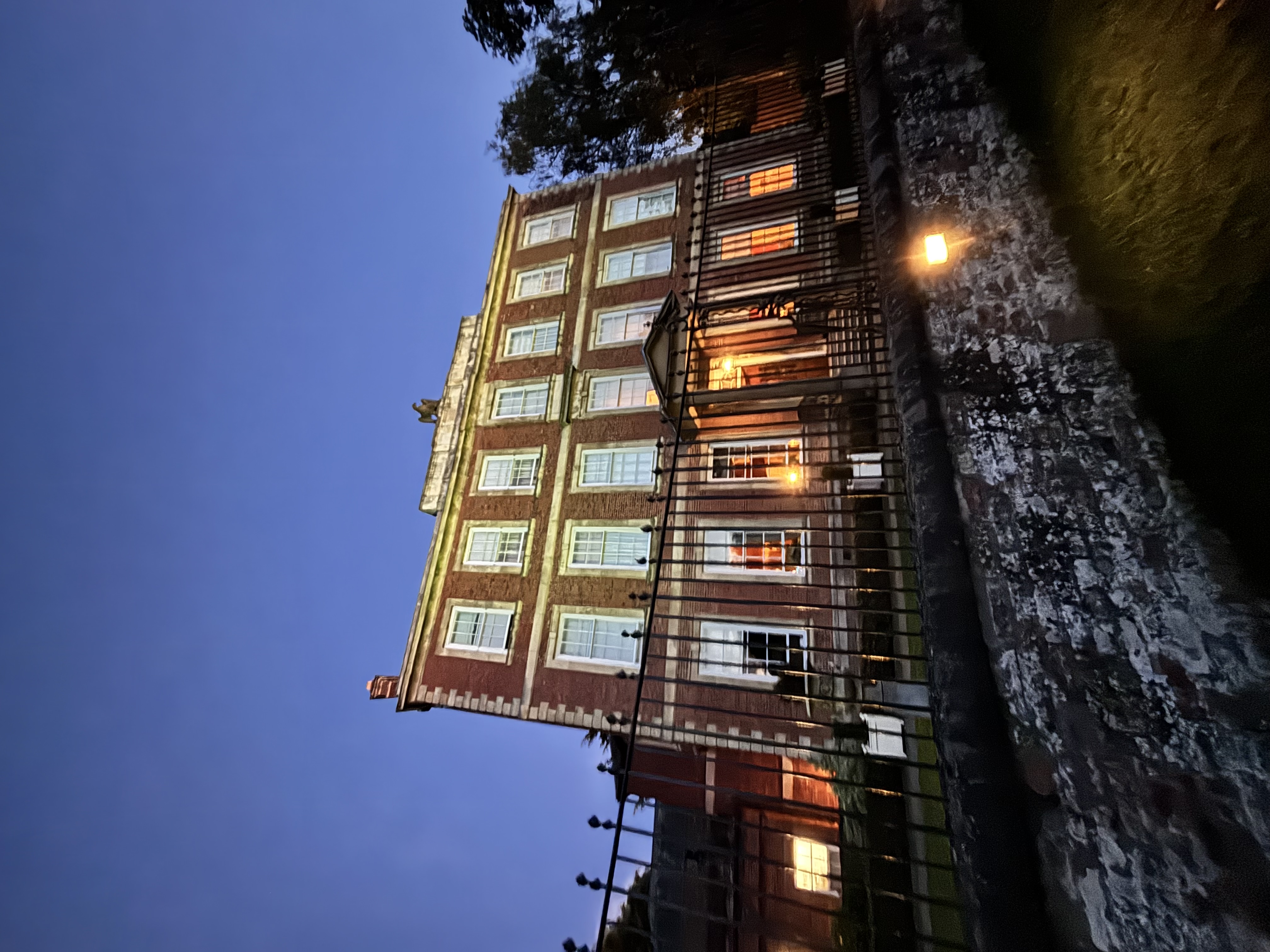 Georgian mansion with illuminated facade at dusk