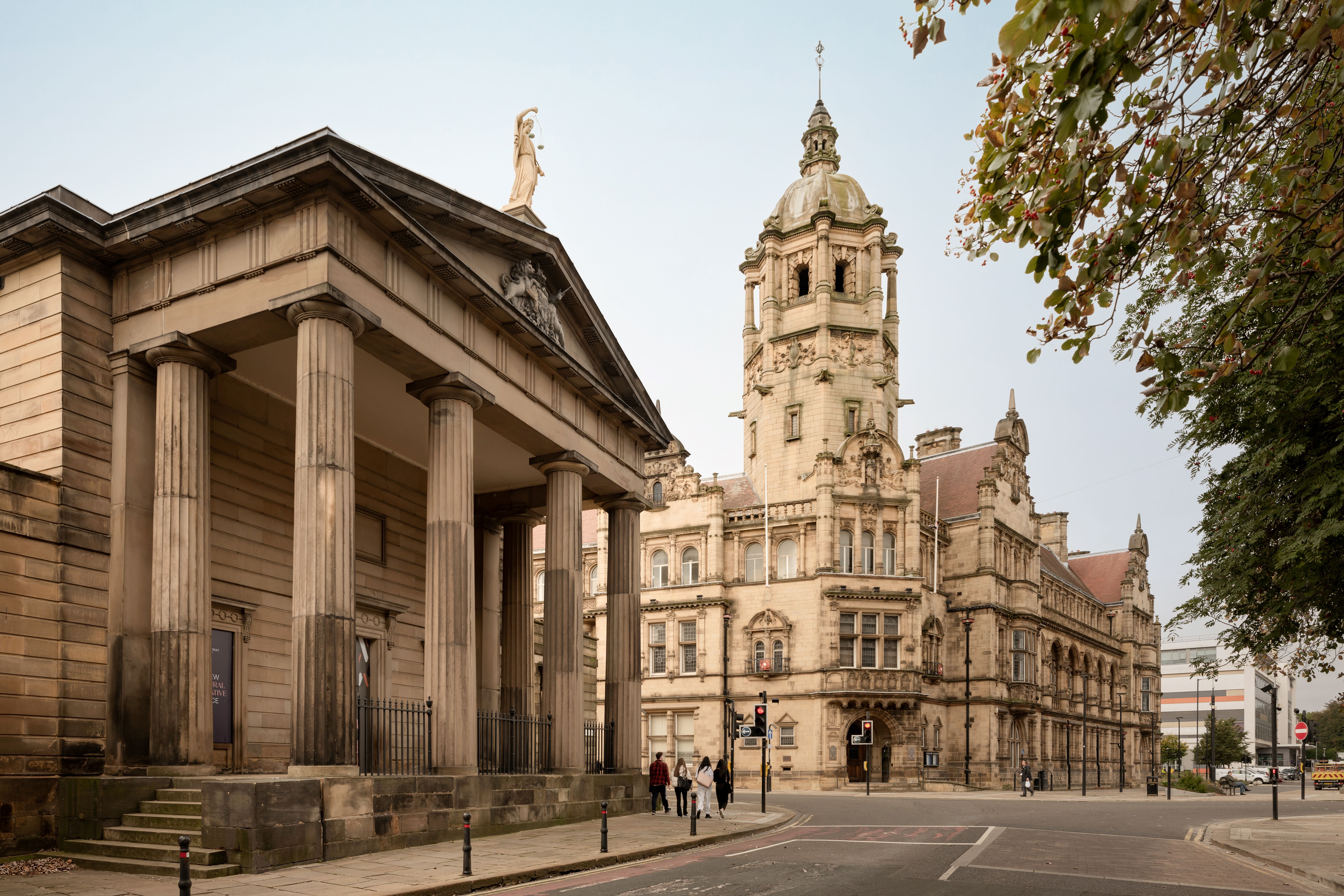 Historic Victorian town hall with clock tower and columns