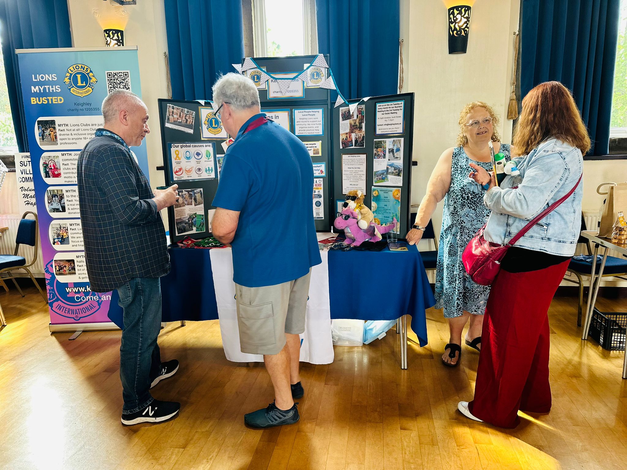 Community event with informational booth and attendees