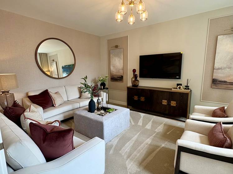 Elegant living room with modern decor and round mirror