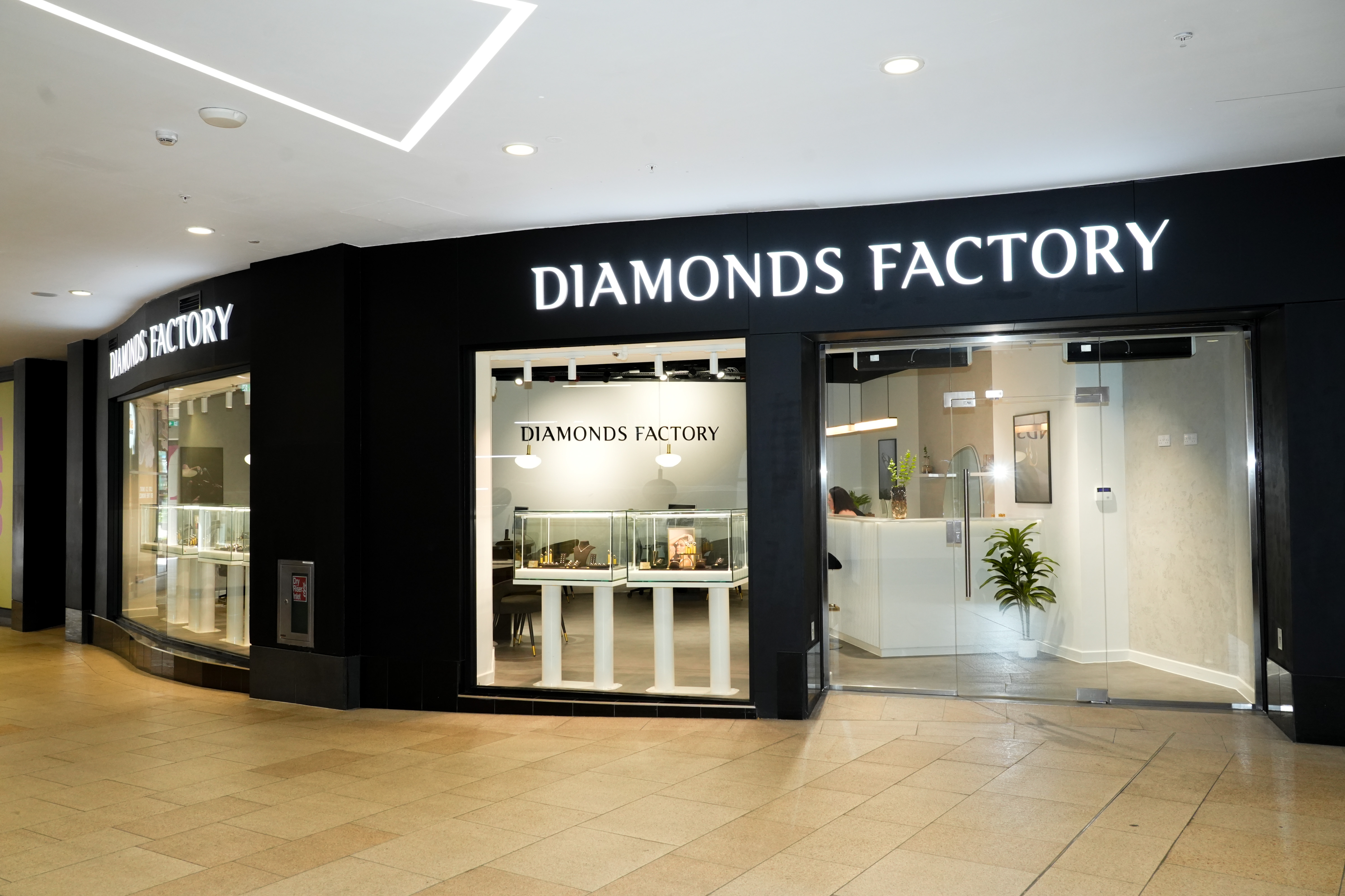 Jewellery shopfront with illuminated Diamonds Factory sign