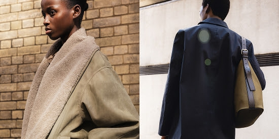 Fashionable person in beige coat against brick wall
