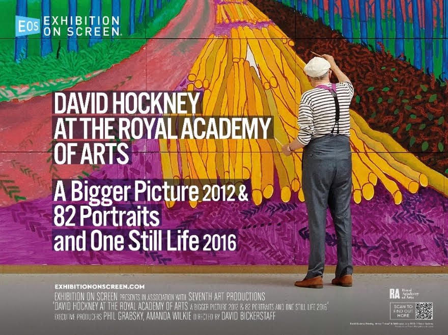 Artist painting a vibrant landscape on a large canvas