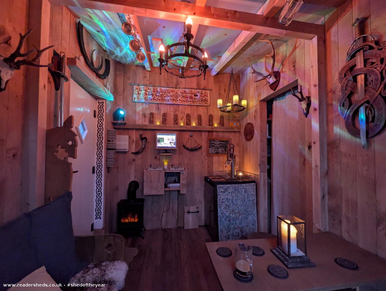 Cozy wooden cabin interior with rustic decor and ambient lighting