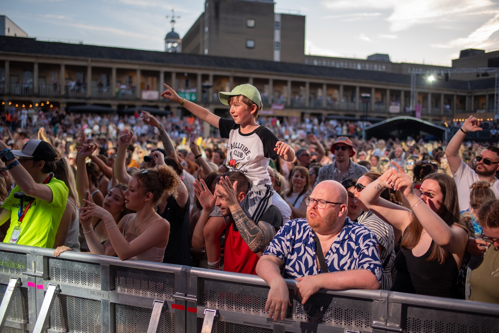 Crowd enjoying outdoor concert at historic venue in Yorkshire - ELLIE SAXX AT THE PIECE HALL