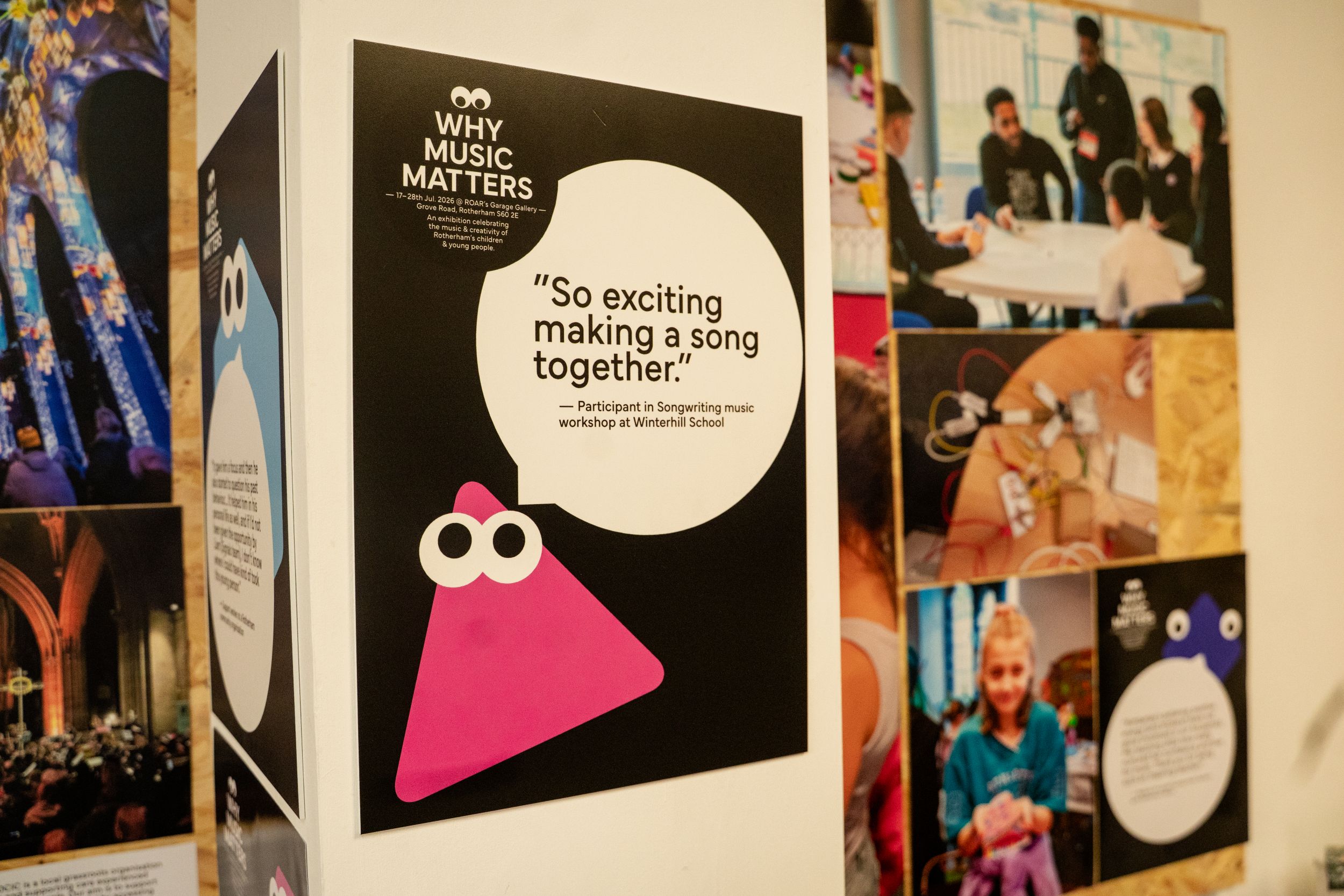 Exhibition wall with music workshop posters and quotes