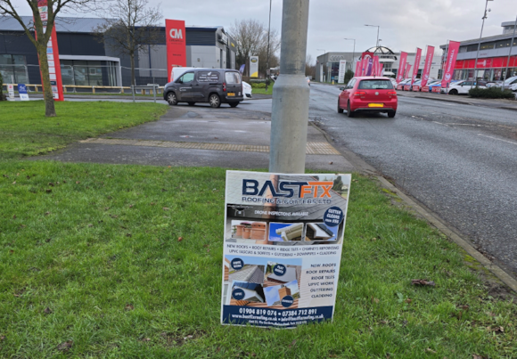 Commercial area in Yorkshire with signage and parked cars