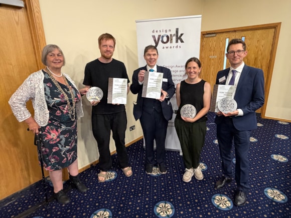 Group of five people holding awards at Yorkshire ceremony