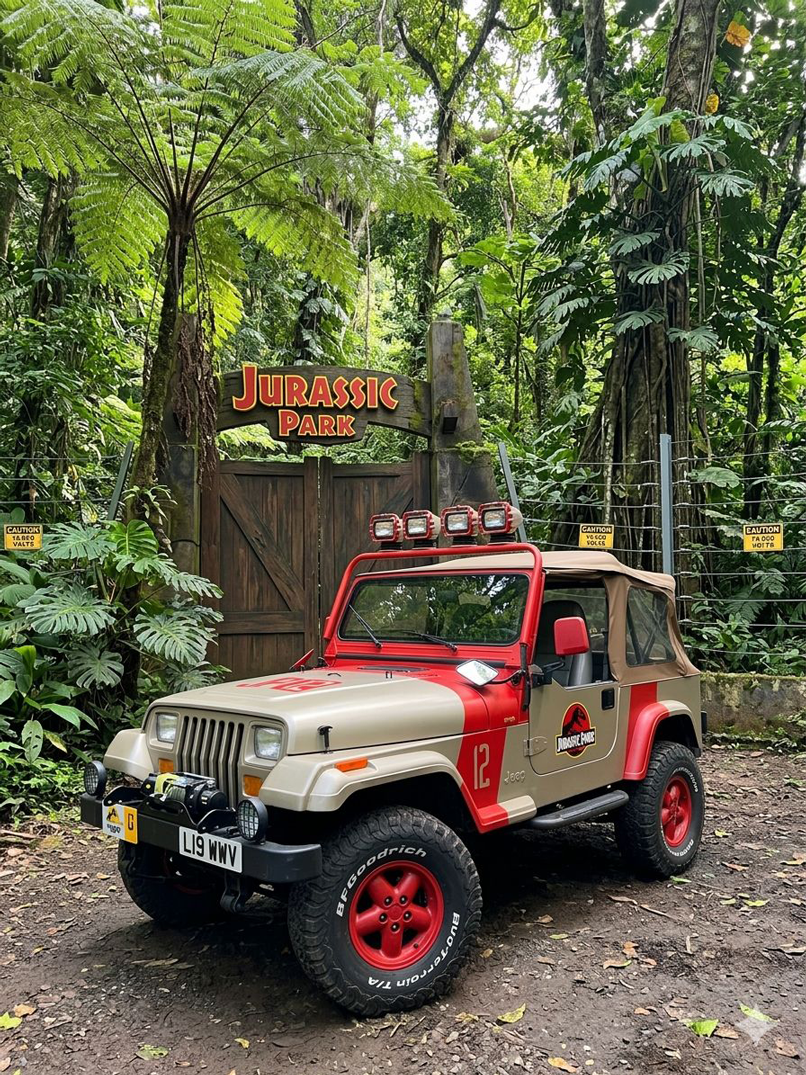Vintage off-road vehicle at Jurassic Park entrance in forest