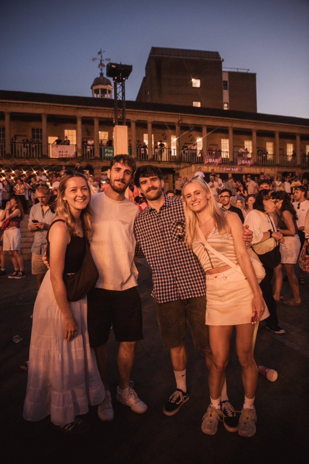 Group of friends smiling at an outdoor festival in Yorkshire