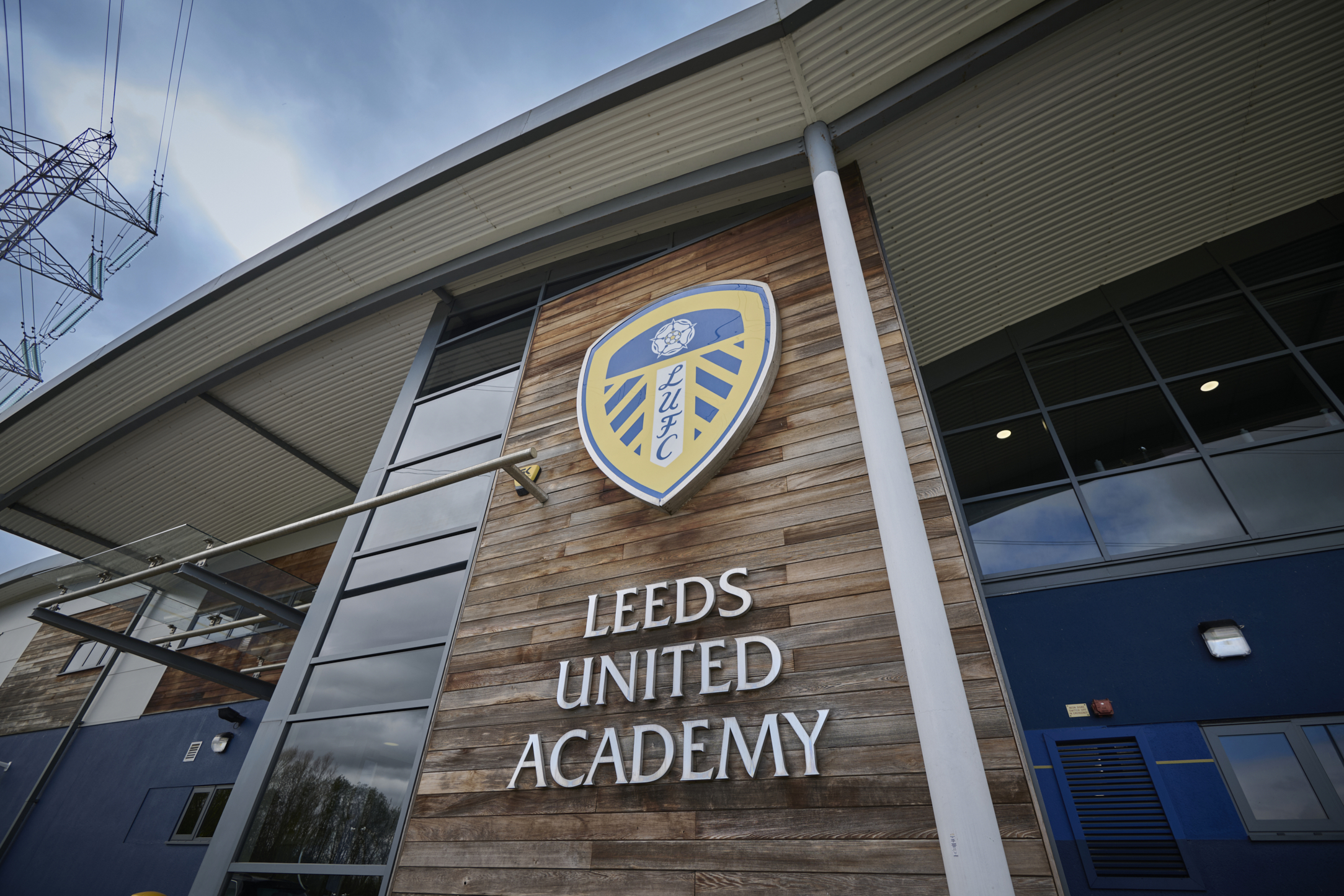 Leeds United Academy entrance with club logo on wooden facade