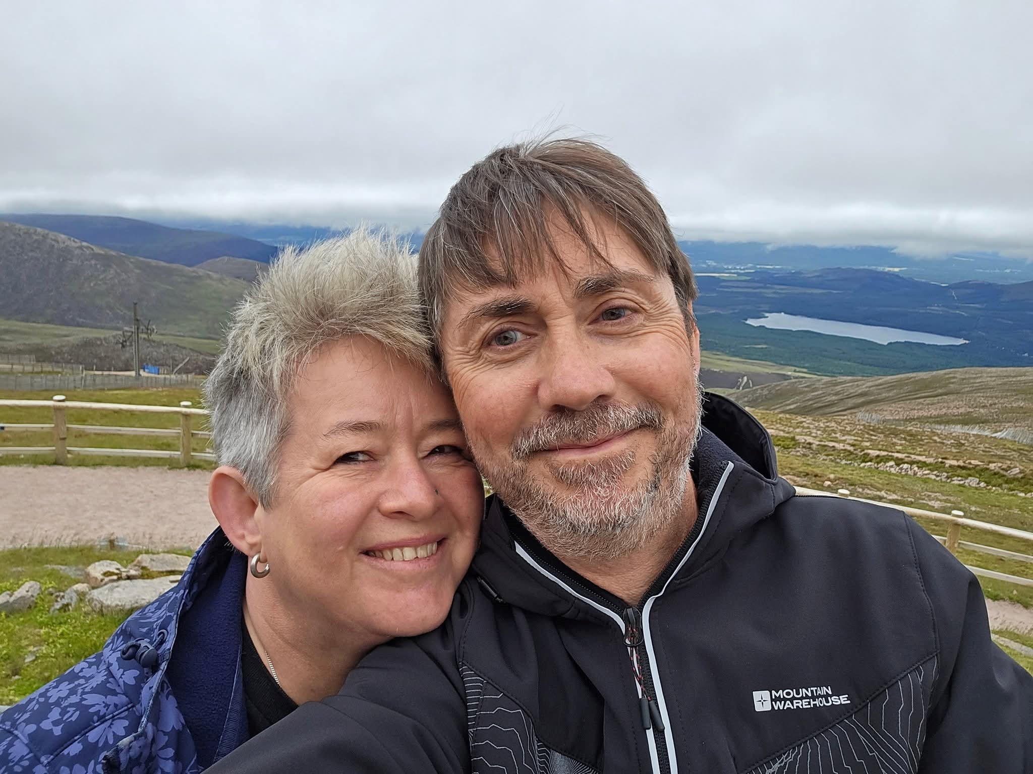 Smiling couple with Yorkshire Dales in the background