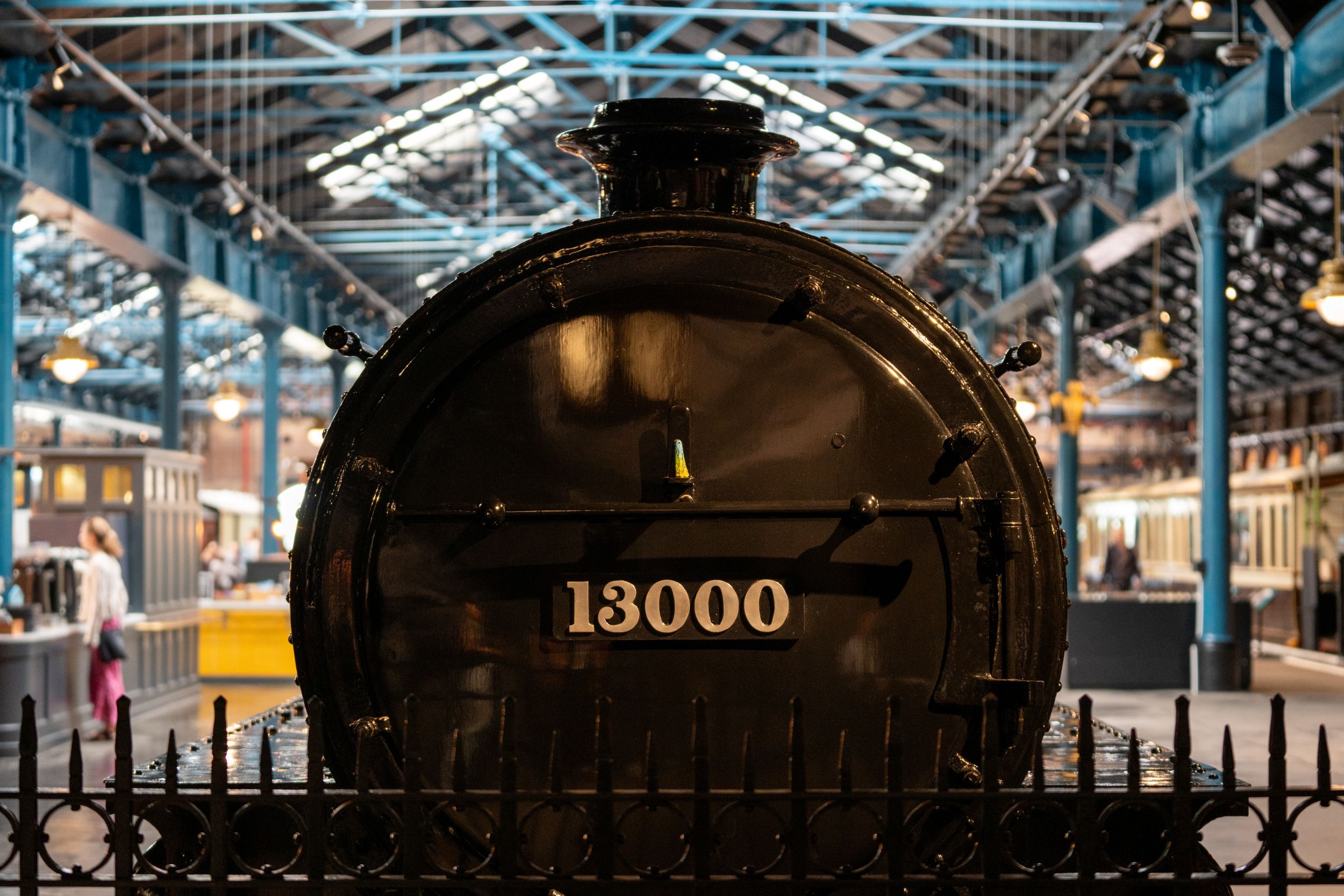 Historic black steam locomotive with number 13000 in railway museum