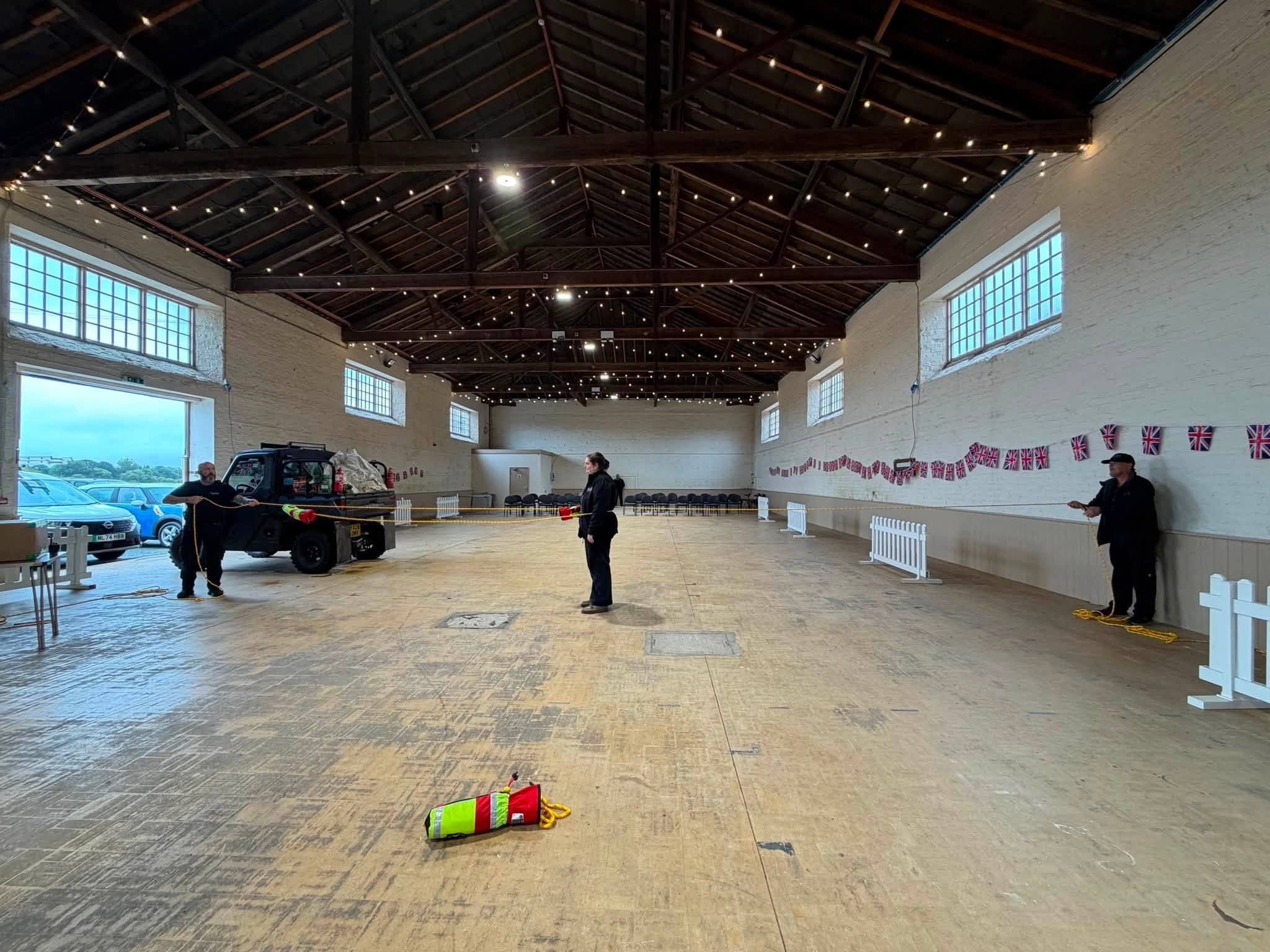 Spacious rustic hall with wooden beams and Union Jack bunting