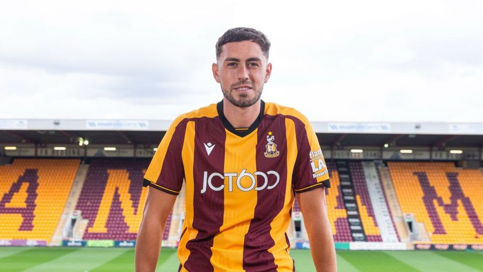 Footballer in Bradford City kit at Valley Parade stadium