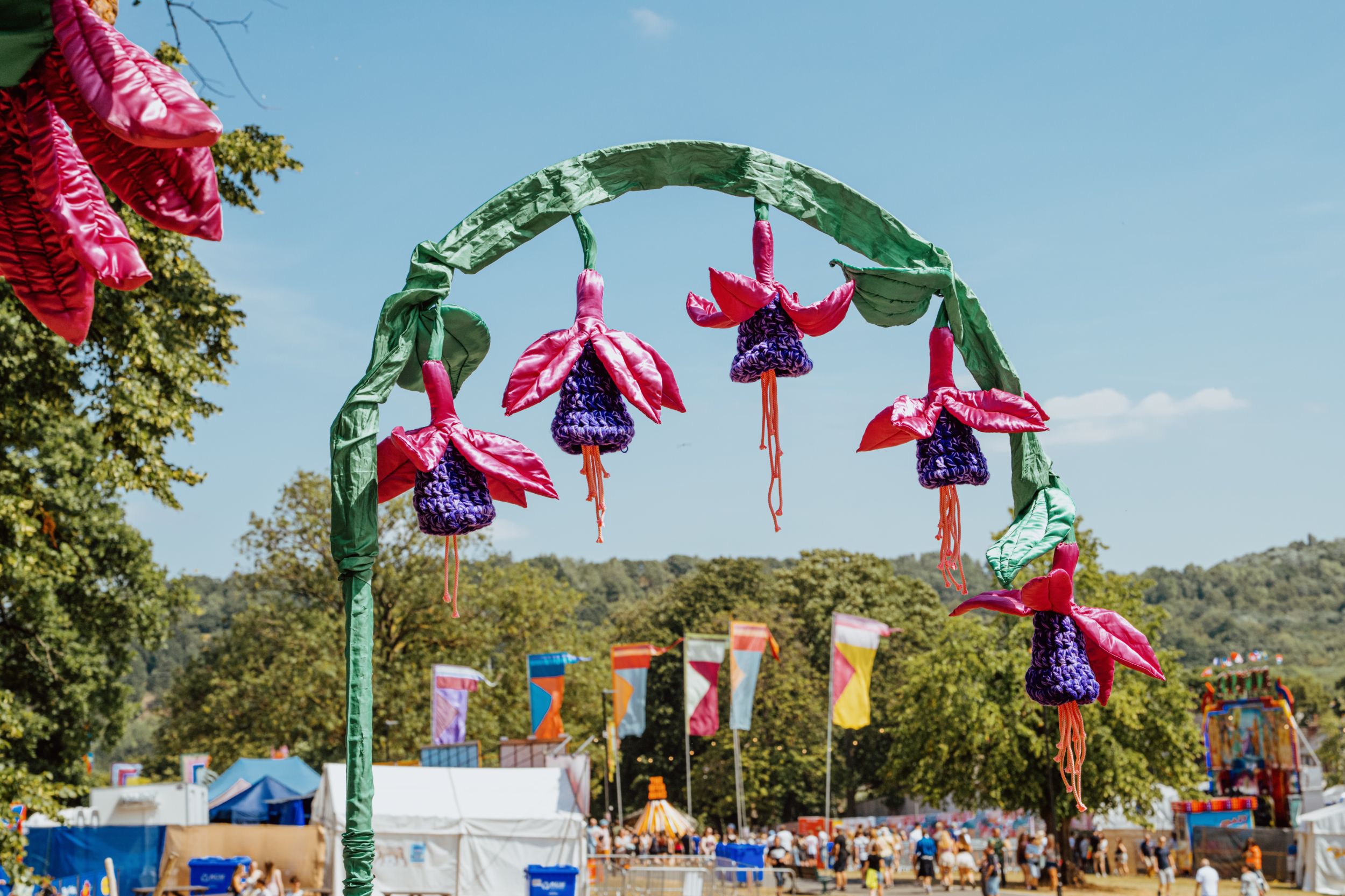 Colourful festival arch with flower decorations in a park