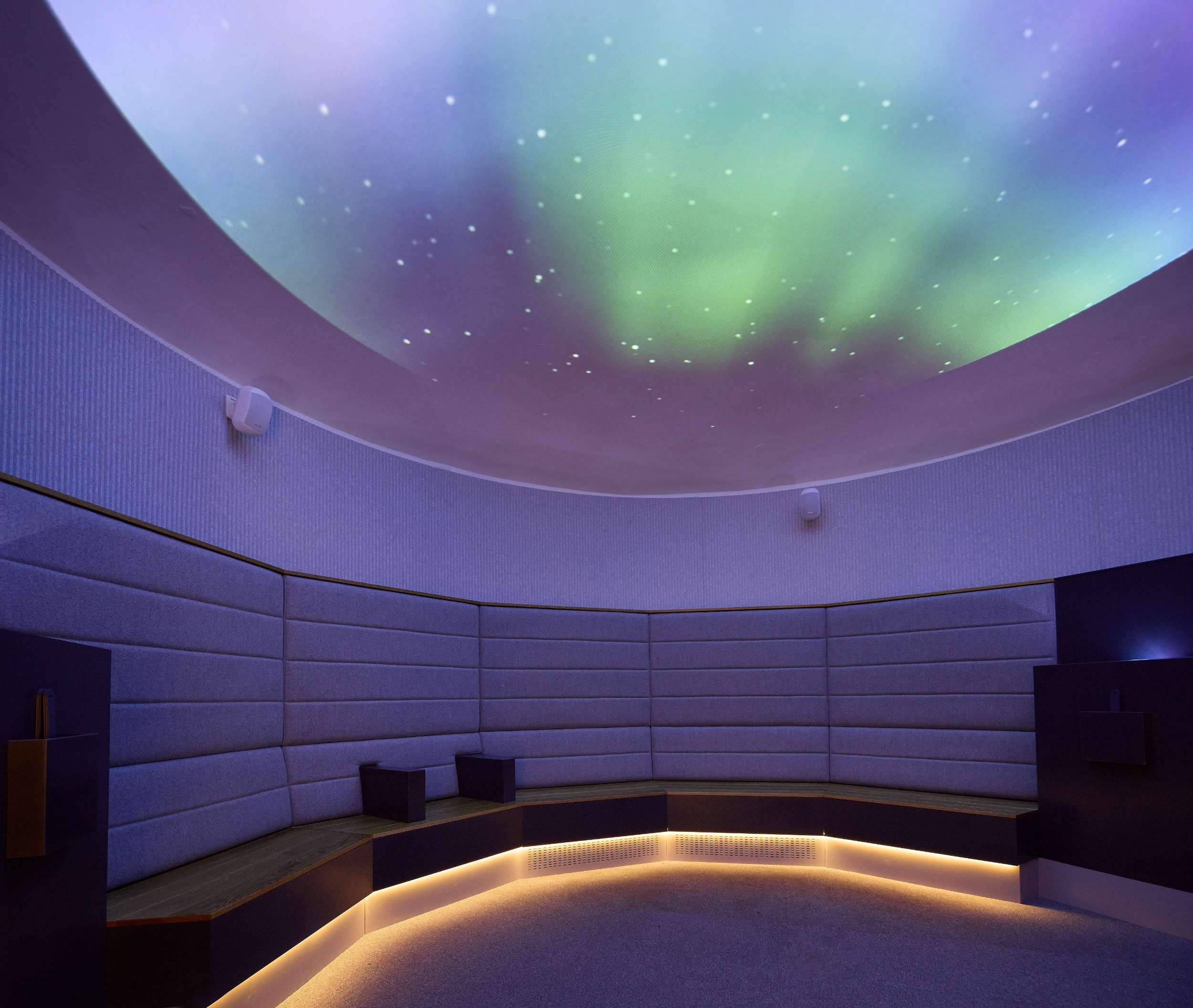Modern planetarium interior with starry sky projection