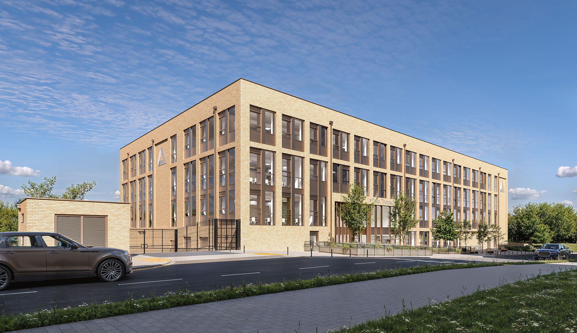 Modern brick office building with large windows under blue sky