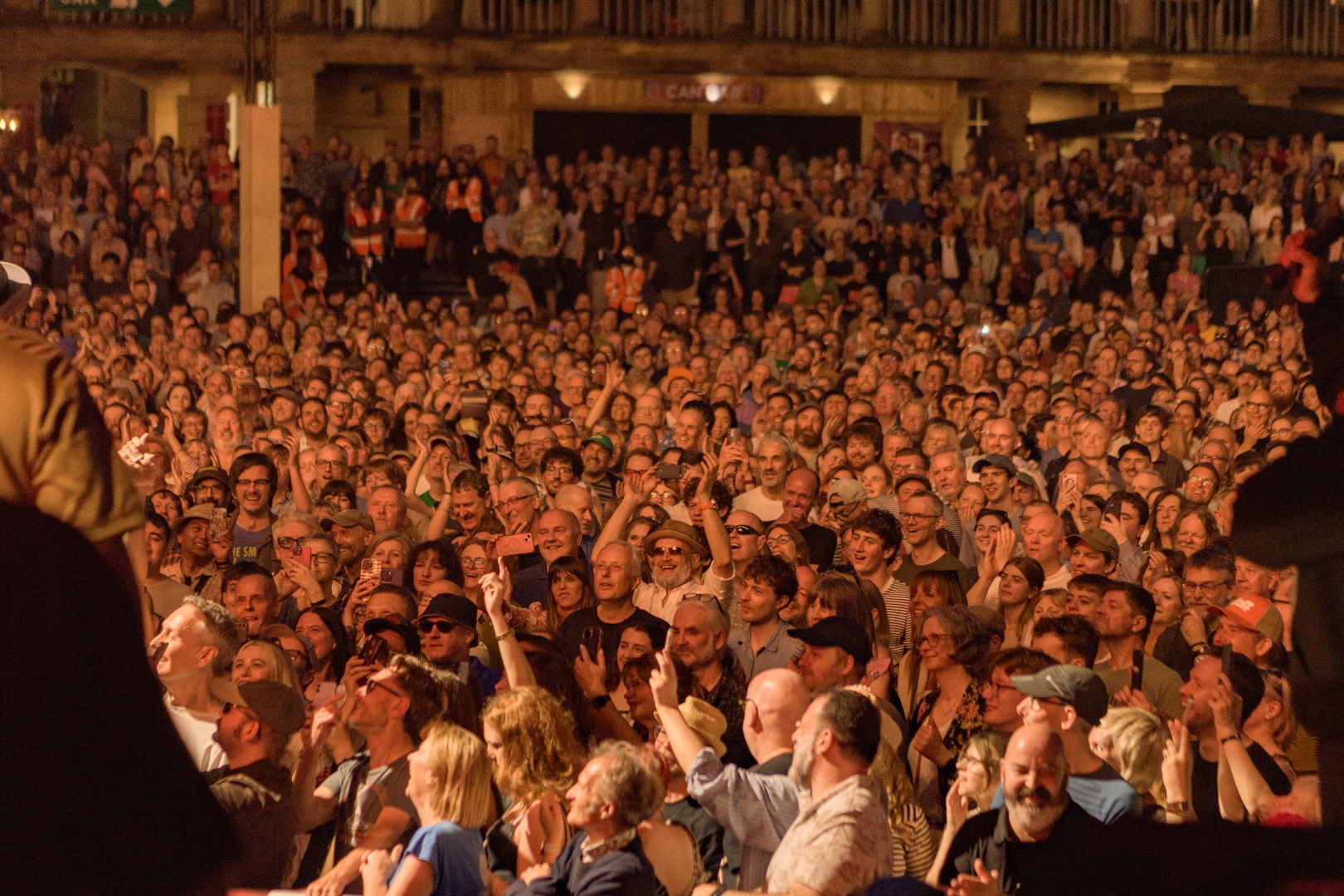 Large crowd enjoying outdoor concert at night in Yorkshire